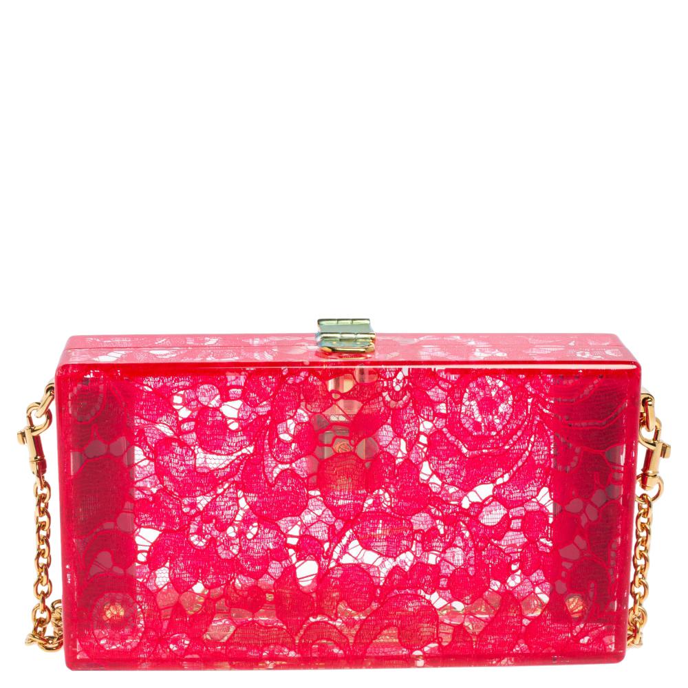 Crafted in Italy, it is made from quality acrylic and comes in a lovely shade of red. The bag flaunts a lace pattern all over, a single chain in gold-tone, and a padlock that carries the brand logo as well as a floral motif. The bag opens to an