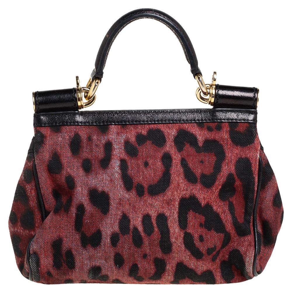 The iconic Miss Sicily bag by Dolce & Gabbana is named after Domenico Dolce's native land and exhibits the aesthetic of Italian glamour. The neat silhouette is made from leather flaunting leopard print and features a front flap accented with the