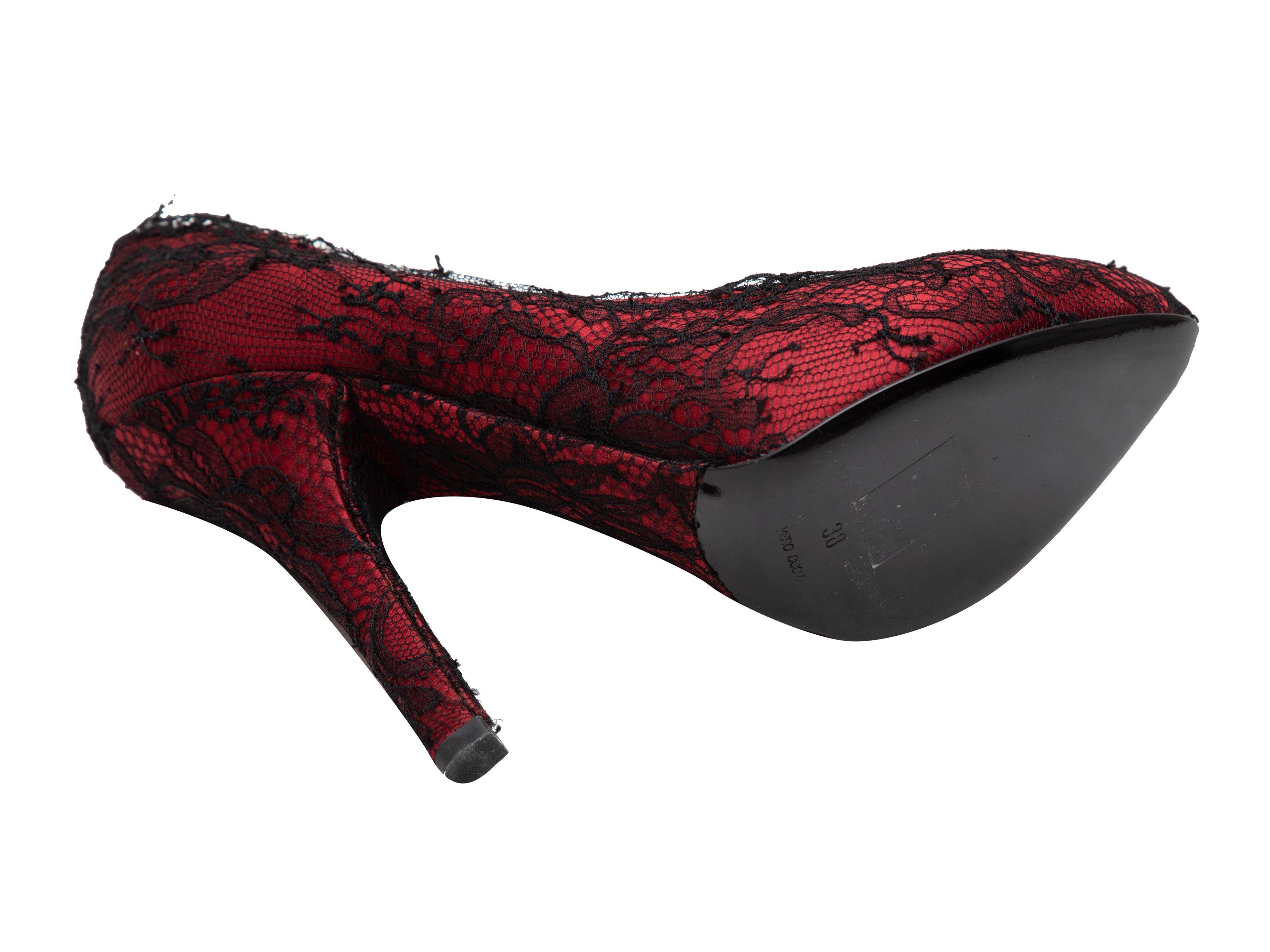 Product Details: Red and black satin and lace overlay almond-toe pumps by Dolce & Gabbana. 5
