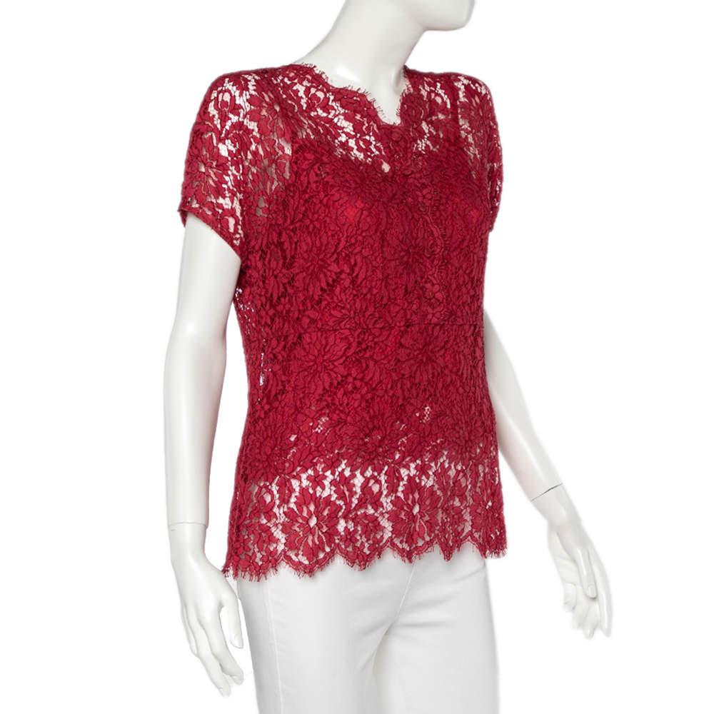 Dolce & Gabbana's clothes are known for their unique designs that emanate the label's feminine verve and immaculate craftsmanship that makes their creations last season after season. Made from intricate lace, the top features a beautiful red shade