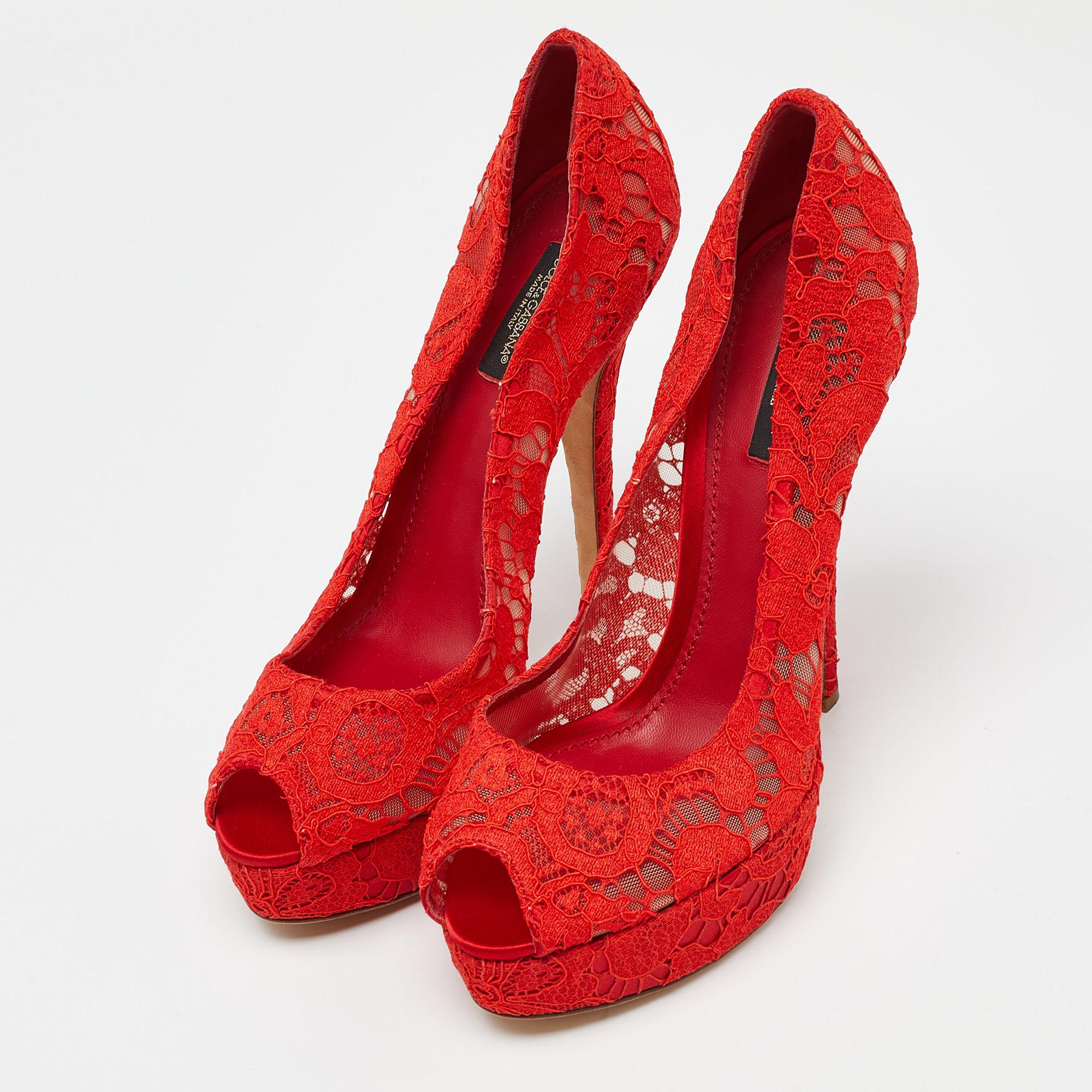 Defining sensuality with unparalleled class, this sultry pair by Dolce & Gabbana is a must have! Made from red satin & lace, they are delicately coupled with peep toes and 14cm heels. Perfect for a host of occasions, these pumps will take your look