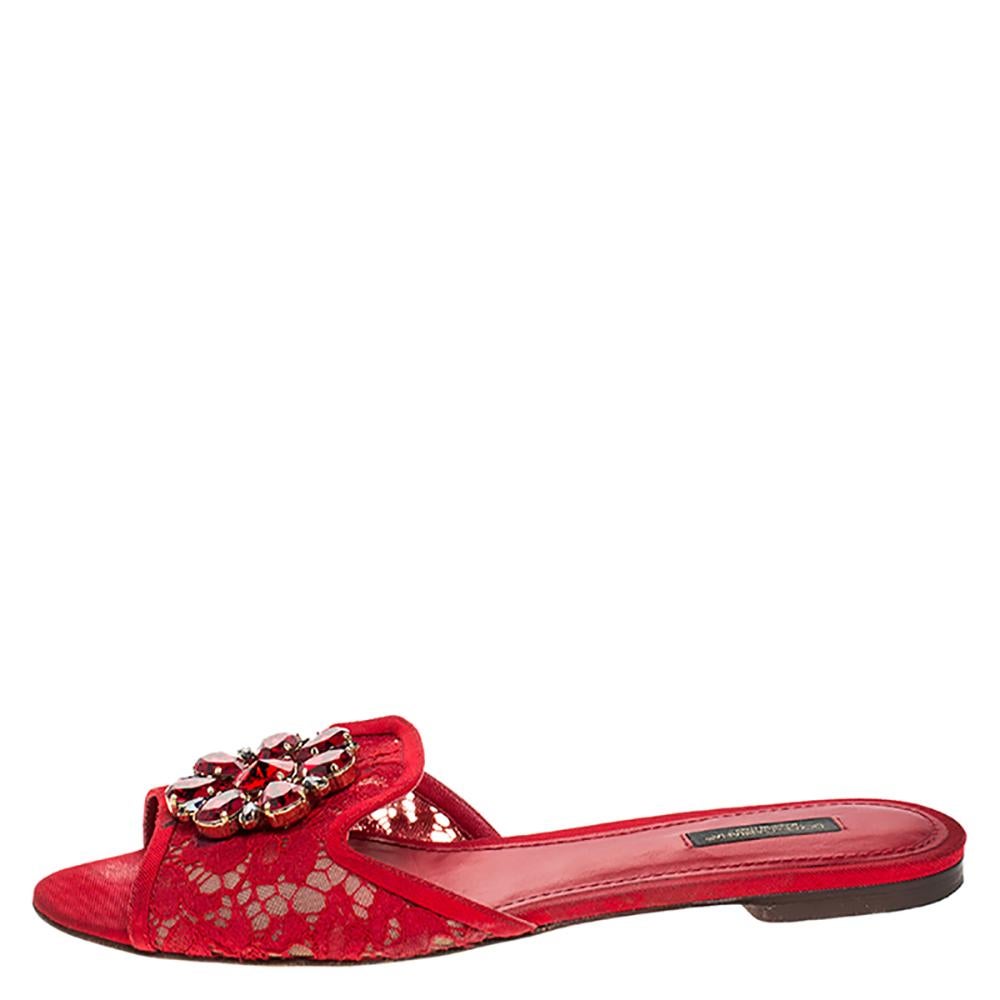 These beautiful lace flats are a perfect option while choosing footwear for any occasion. They feature leather insoles to keep your feet comfortable. Designed by Dolce & Gabbana, the red slides are graced with crystals.

