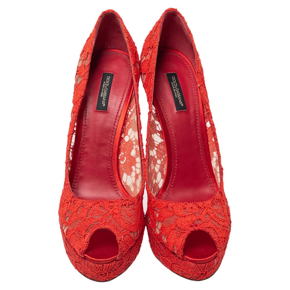 These stylish Dolce & Gabbana pumps are dramatic and perfect to make a statement. Crafted from intricate lace, They come in a lovely shade of red. They are styled with peep toes, platforms, 14.5 cm heels and leather soles. Grab them now!

Includes: