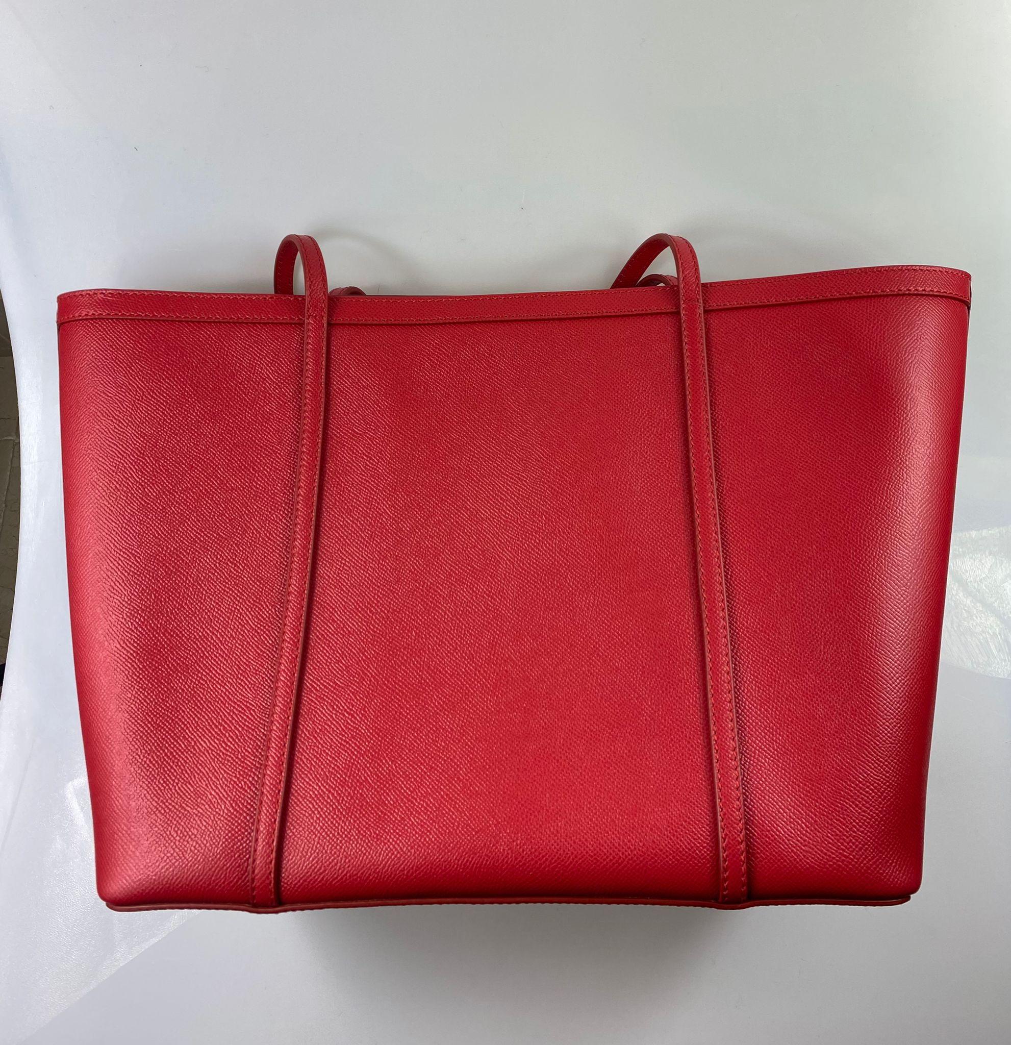 Absolutely stunning, 100% Authentic, brand new with tags Dolce & Gabbana leather shopping tote bag.

Model: Shopping Tote Bag

Color: Red with gold metal detailing

Material: 100% Leather

Magnetic closure

Logo details

Made in Italy

Very
