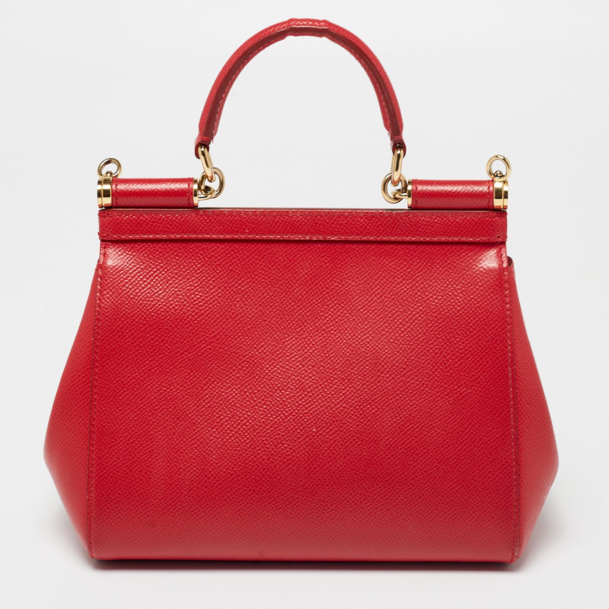 The Miss Sicily bag is one of the most celebrated creations from Dolce & Gabbana. This red bag beautifully embodies the spirit of extravagance that the Italian luxury brand carries. Crafted from leather, it has a chic shape and comes with a front