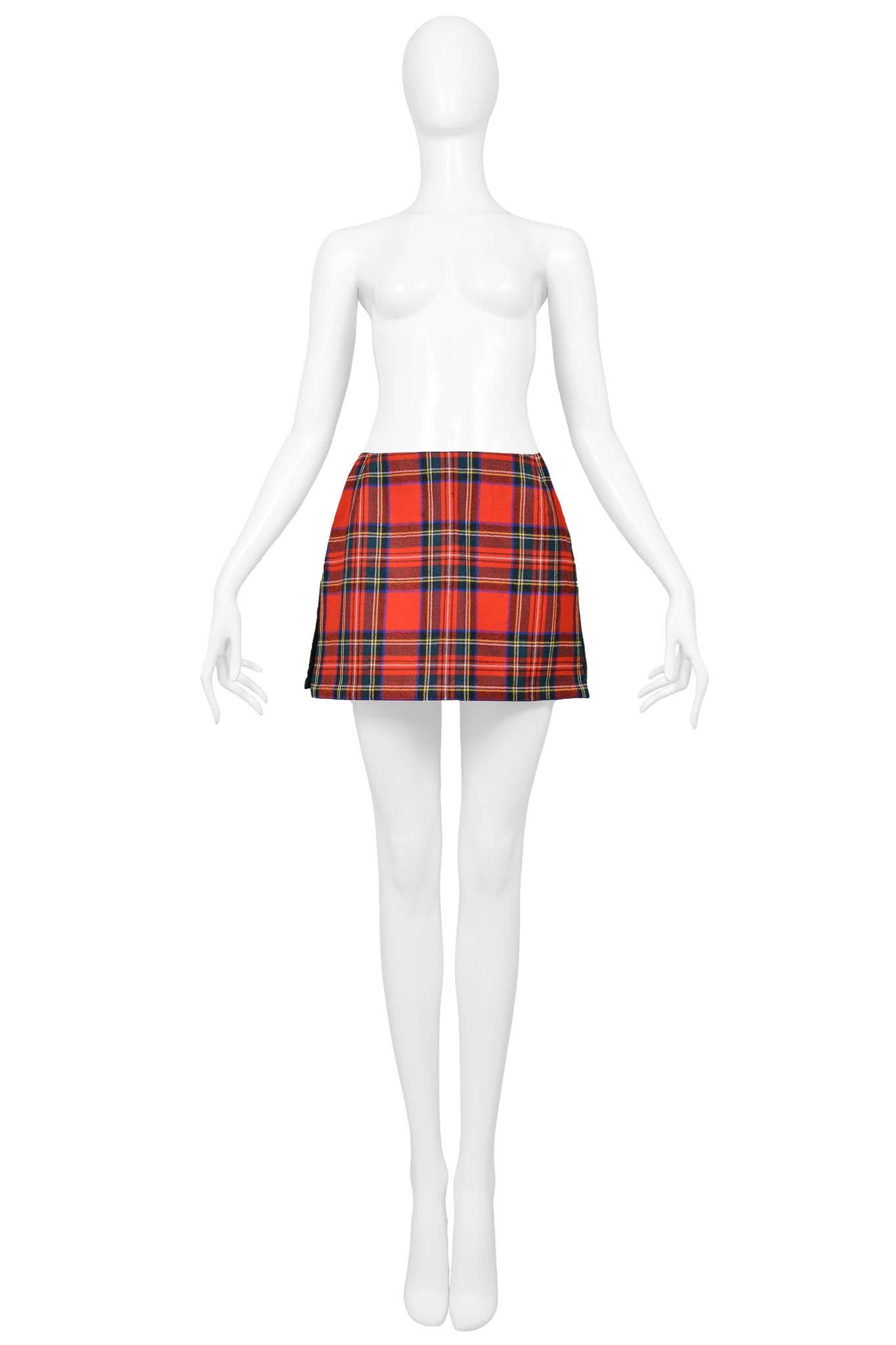 Resurrection Vintage is excited to offer a vintage Dolce & Gabbana (with original tags) mini skirt featuring a plaid front, velcro side closure, red topstitching design, and pockets on the back.

Dolce & Gabbana
Size: 38
Fabric: Wool, Cotton,