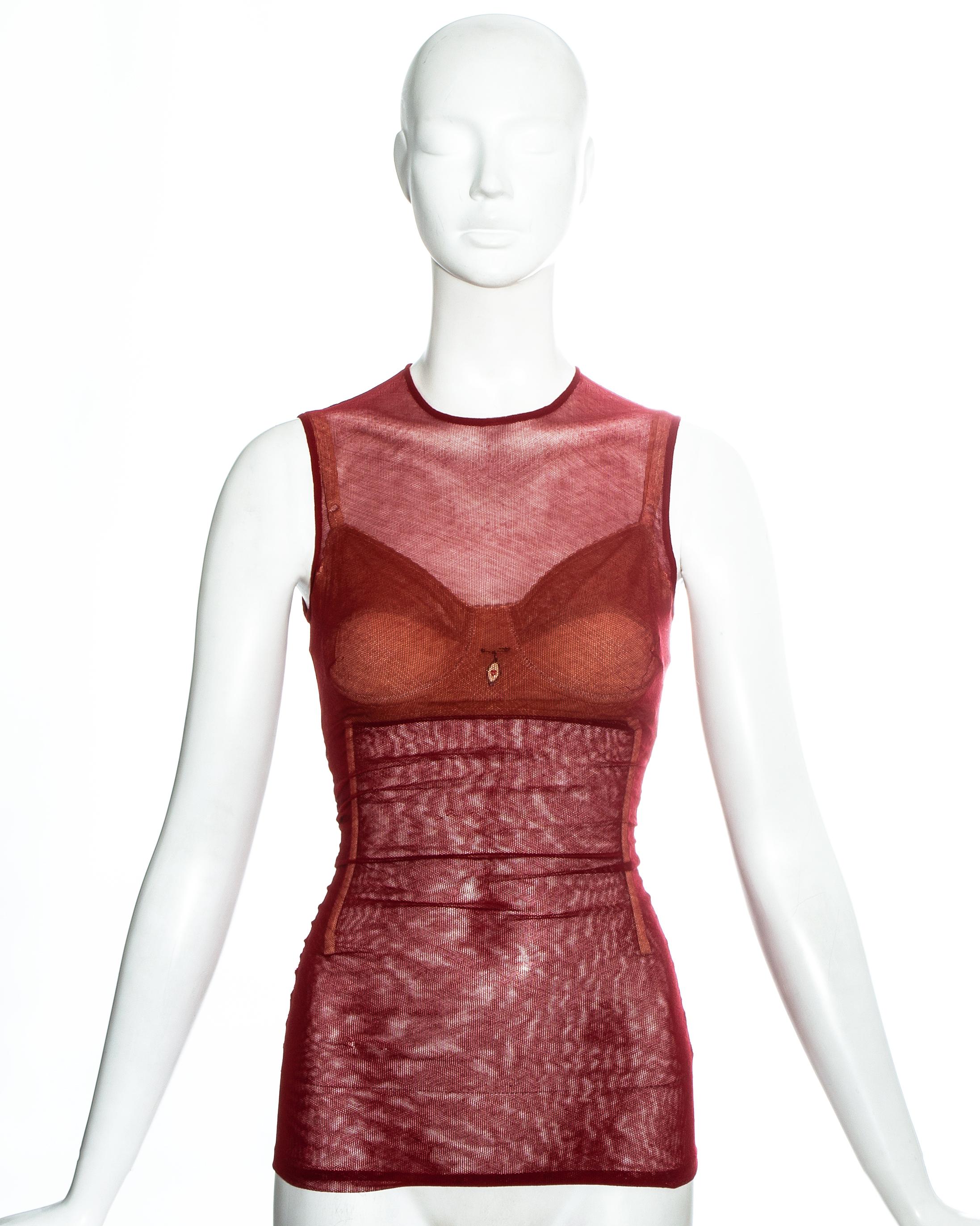 Dolce & Gabbana red power mesh evening corset with internal boning, exposed back zipper and built in nude bra with a safety pin broach

Spring-Summer 1998