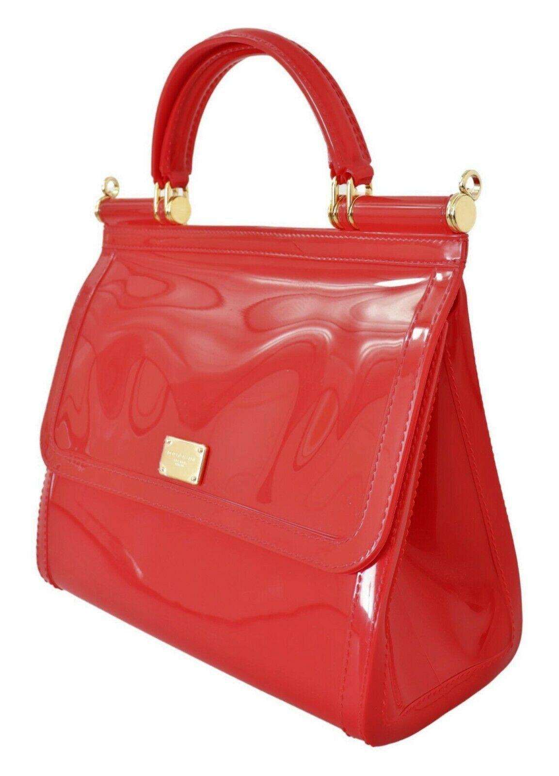 Absolutely stunning, 100% Authentic, brand new with tags Dolce & Gabbana bag purse.

Model: Sicily Bag

Color: Red with gold detailing

Material: 100% PVC

Double handle, shoulder strap is missing

Magnetic closure

Logo details

Made in Italy

Very