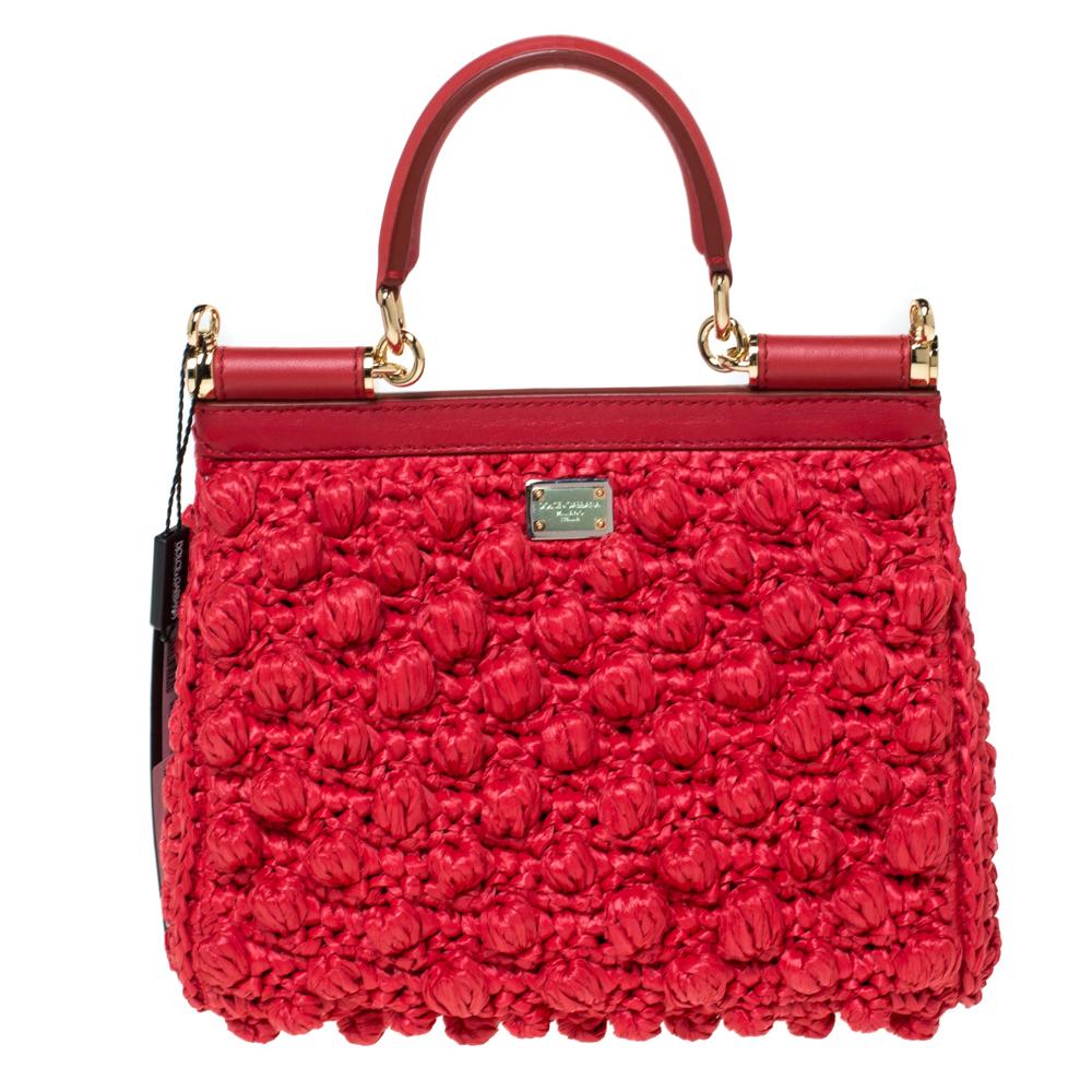 The Miss Sicily tote is one of the most celebrated creations from Dolce & Gabbana. The tote beautifully embodies the spirit of extravagance and feminity that the Italian luxury brand carries. Crafted in a fabric blend, the bag features a crochet