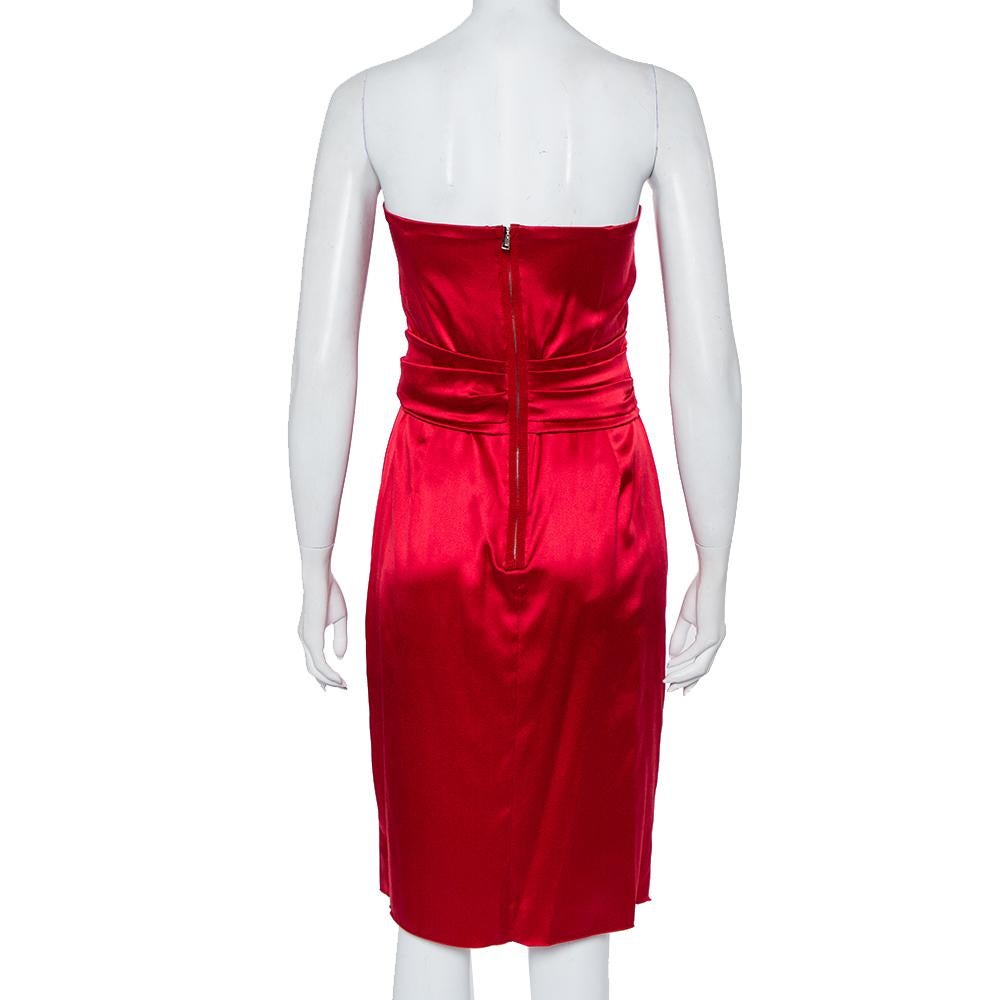 Let your style do the talking when you wear this Dolce & Gabbana dress and go out. This red outfit brings about a subtle yet poised touch to your attire. Comfortable and classic for all seasons, this satin dress is an elegant staple.

Includes:Brand