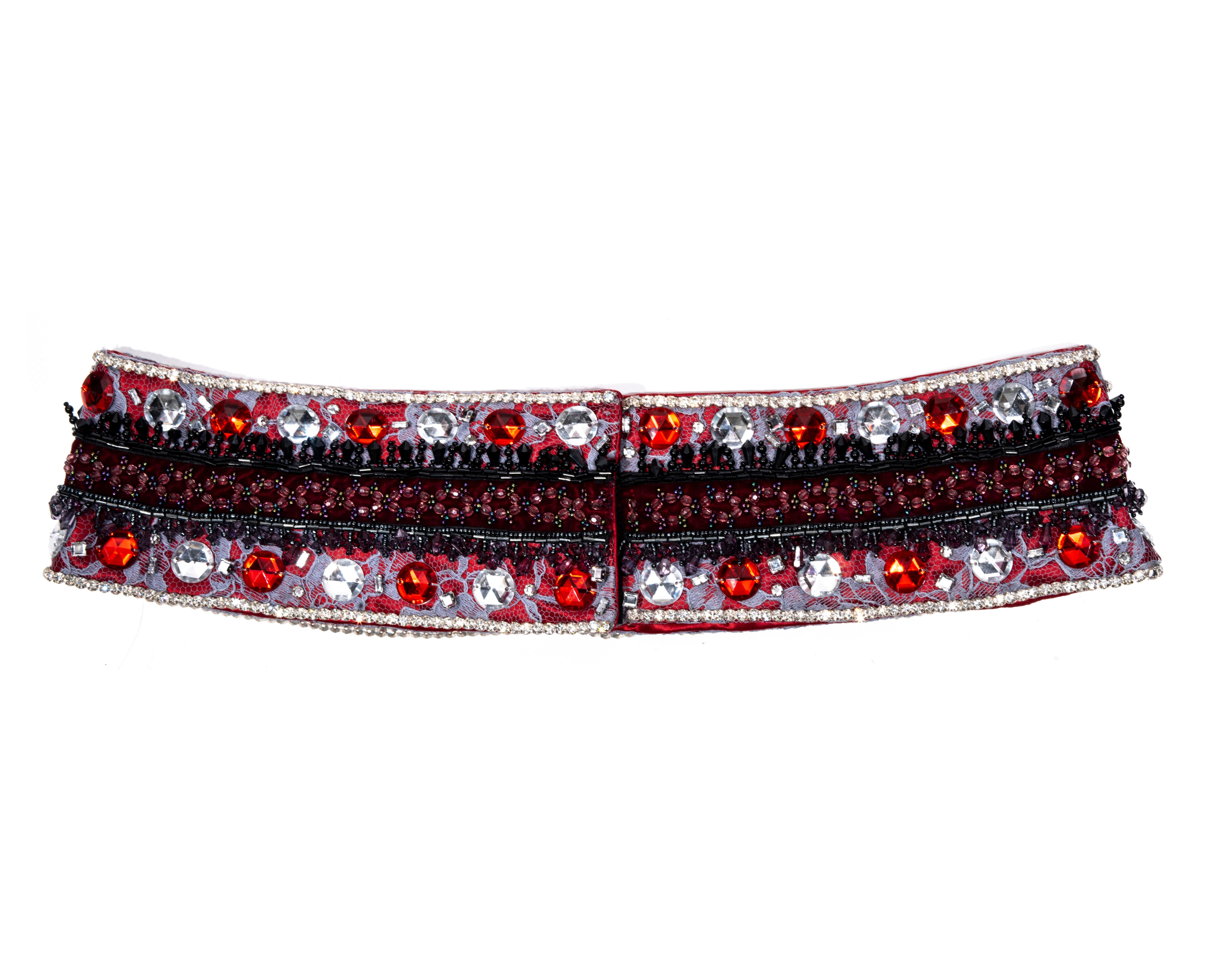 ▪ Dolce & Gabbana red silk and lace evening hip belt 
▪ Crystal trim 
▪ Purple lace overlay 
▪ Large faceted crystals 
▪ Allover embellished with beads
▪ Velcro closure 
▪ IT 40 - FR 36 - UK 8
▪ Fall-Winter 1999
▪ 100% Silk