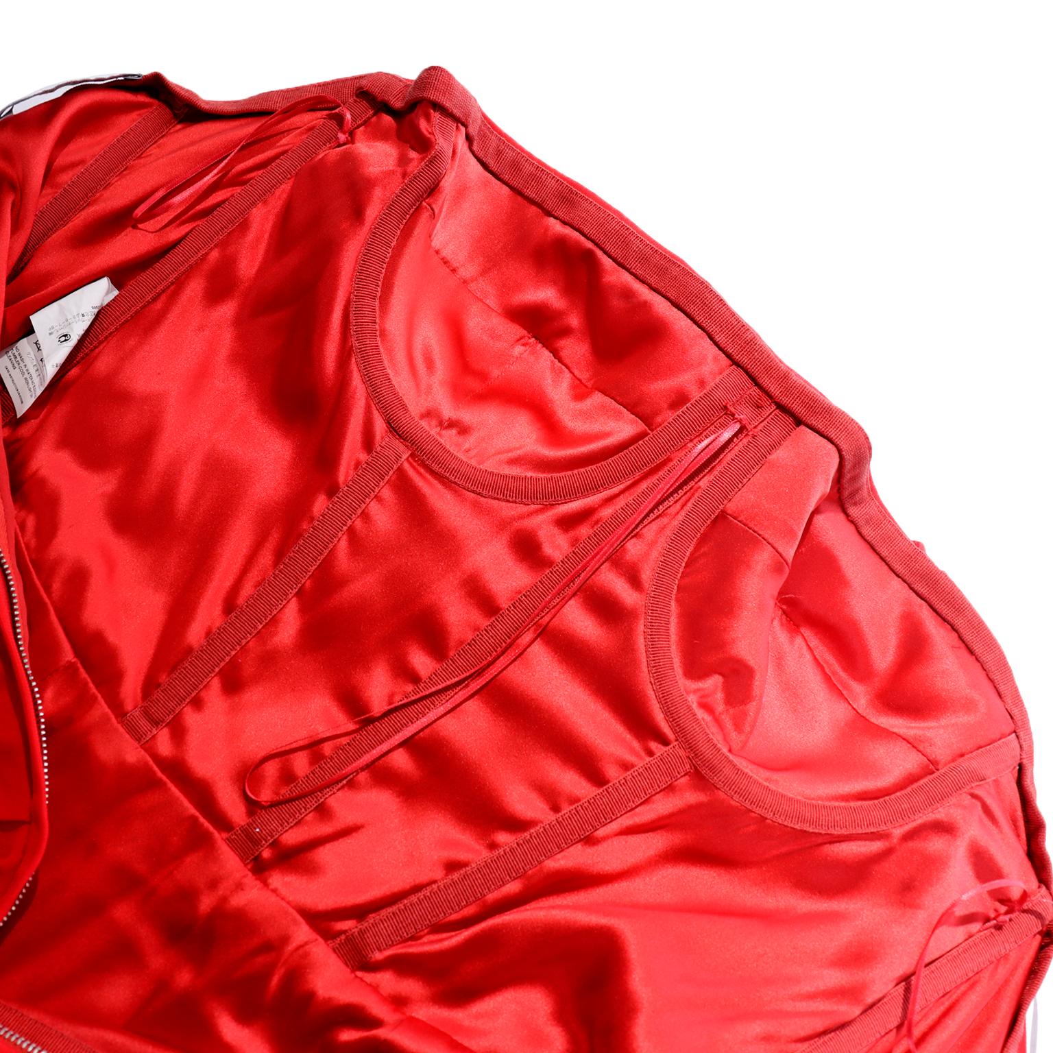 This fabulous cherry red Dolce & Gabbana strapless mini dress has dramatic ruching and a bodycon silhouette. The dress has a built in bustier for stability and closes with a hidden center back zipper with a hook and eye. Dresses like these are so