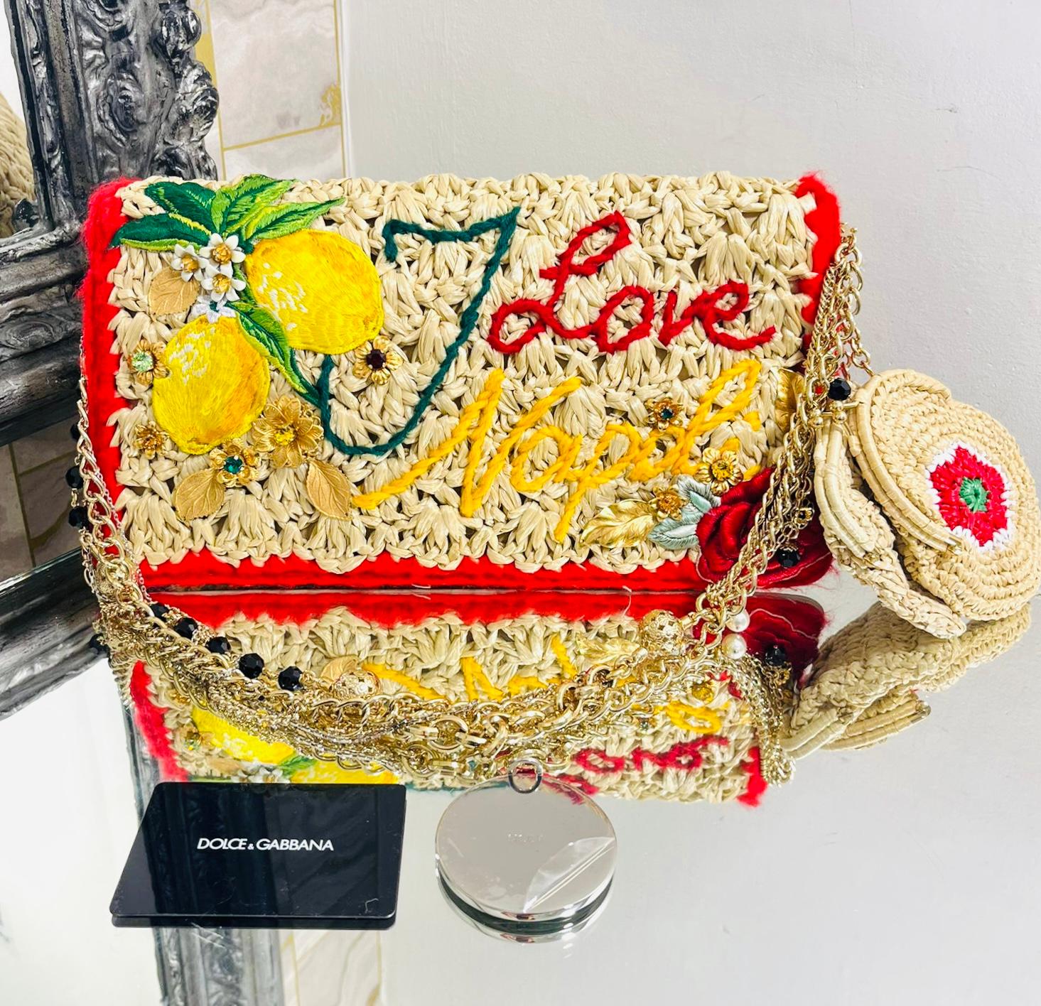 Dolce & Gabbana Rose & Lemons Richly Embellished Raffia Bag

Beige woven handbag embellished with multicoloured 'I Love Napoli' wool embroidery.

Featuring lemons and roses appliques with decorative crystals, flowers and leaves.

Detailed with gold,