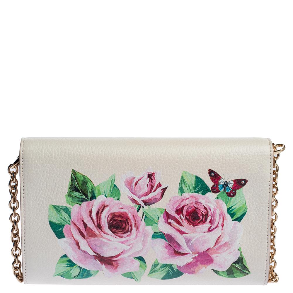 Crafted from leather, this Dolce & Gabbana has a lovely spread of roses on a light pink base and a shiny padlock detail on the front. Equipped with a shoulder strap and a fabric-lined interior, the bag has enough space to house your