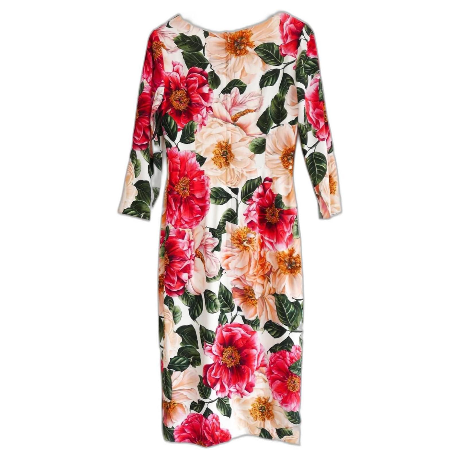 Gorgeous, ultra feminine Dolce & Gabbana rose print dress. Bought for £1850 and new with tags. Made from soft viscose/elastane crepe with a vibrant pink rose print. It has Dolce’s signature pencil cut with midi length skirt, cropped sleeves and off