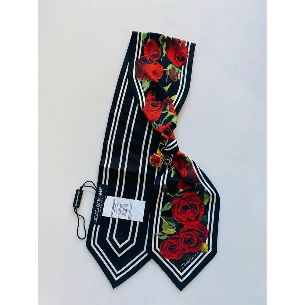 Dolce & Gabbana Rose printed brooche Rose crystal silk scarf 

Size 77cm x 11cm
100% silk 
Brand new with tags 
Made in Italy

General information:
Designer: Dolce & Gabbana
Condition: Never worn, with tag
Material: Silk
Color: Red
Location: