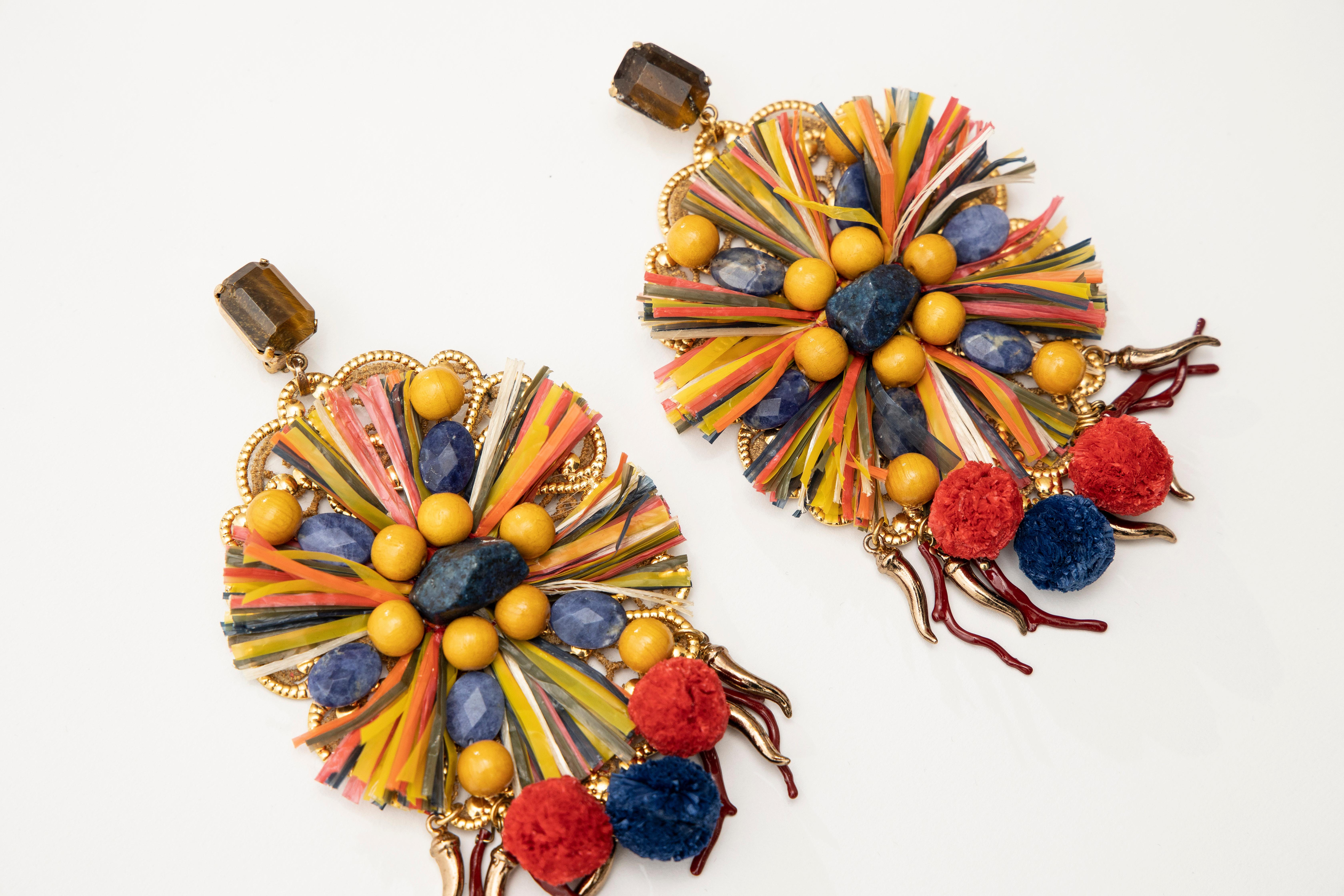  Dolce & Gabbana Runway Spring 2013 clip-on earrings with raffia fringe, pom-pom details, enamel beads, wood beads, lace backing and clip-on closures. 

Original Box &  Certificate of Authenticity