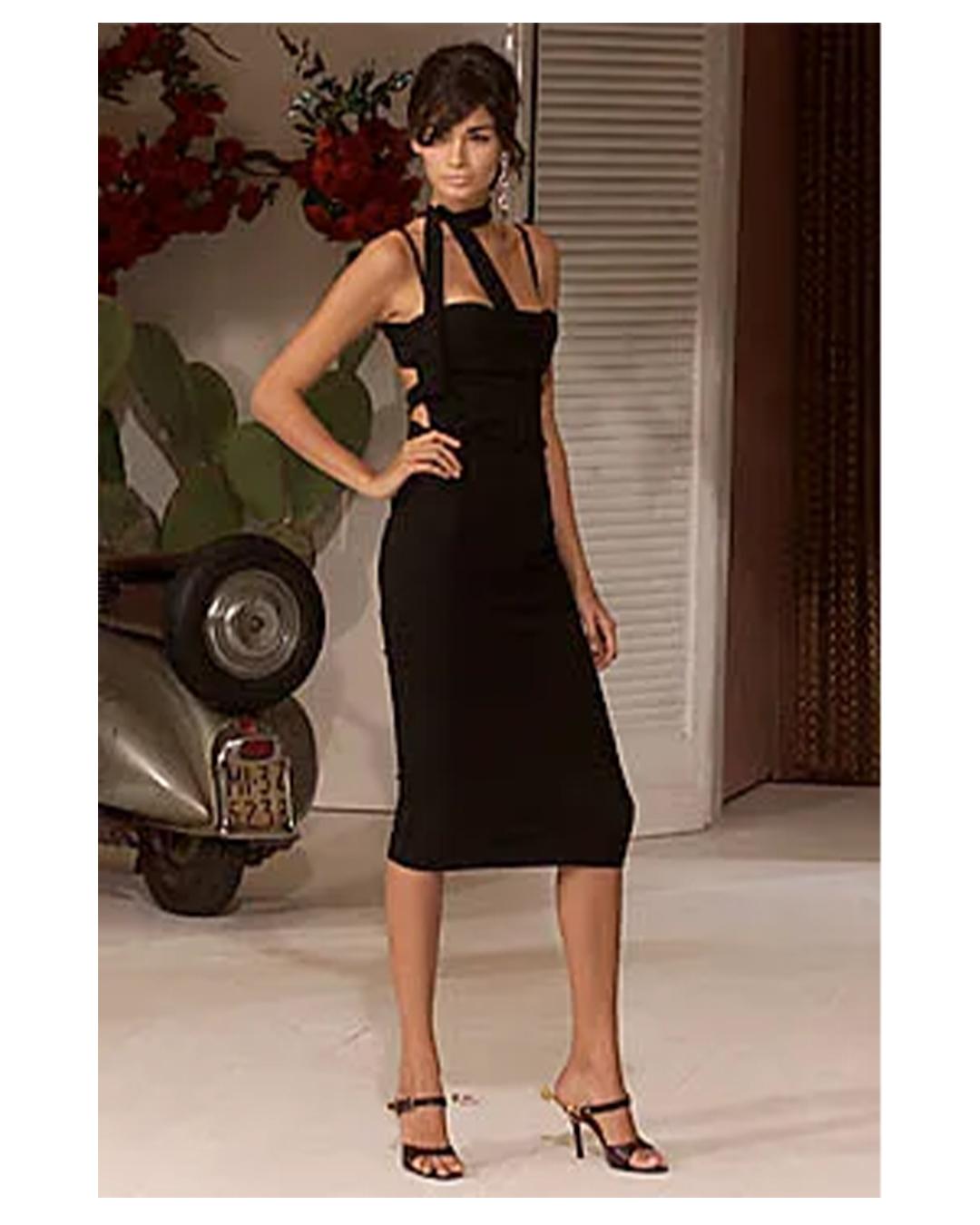 LOVE LALI VINTAGE

Dolce & Gabbana Spring Summer 2001. 
This dress is an incredibly rare version of Look 5 from the runway, in full length burgundy, a version that is virtually impossible to come by!
The dress is a deep burgundy, it appears lighter