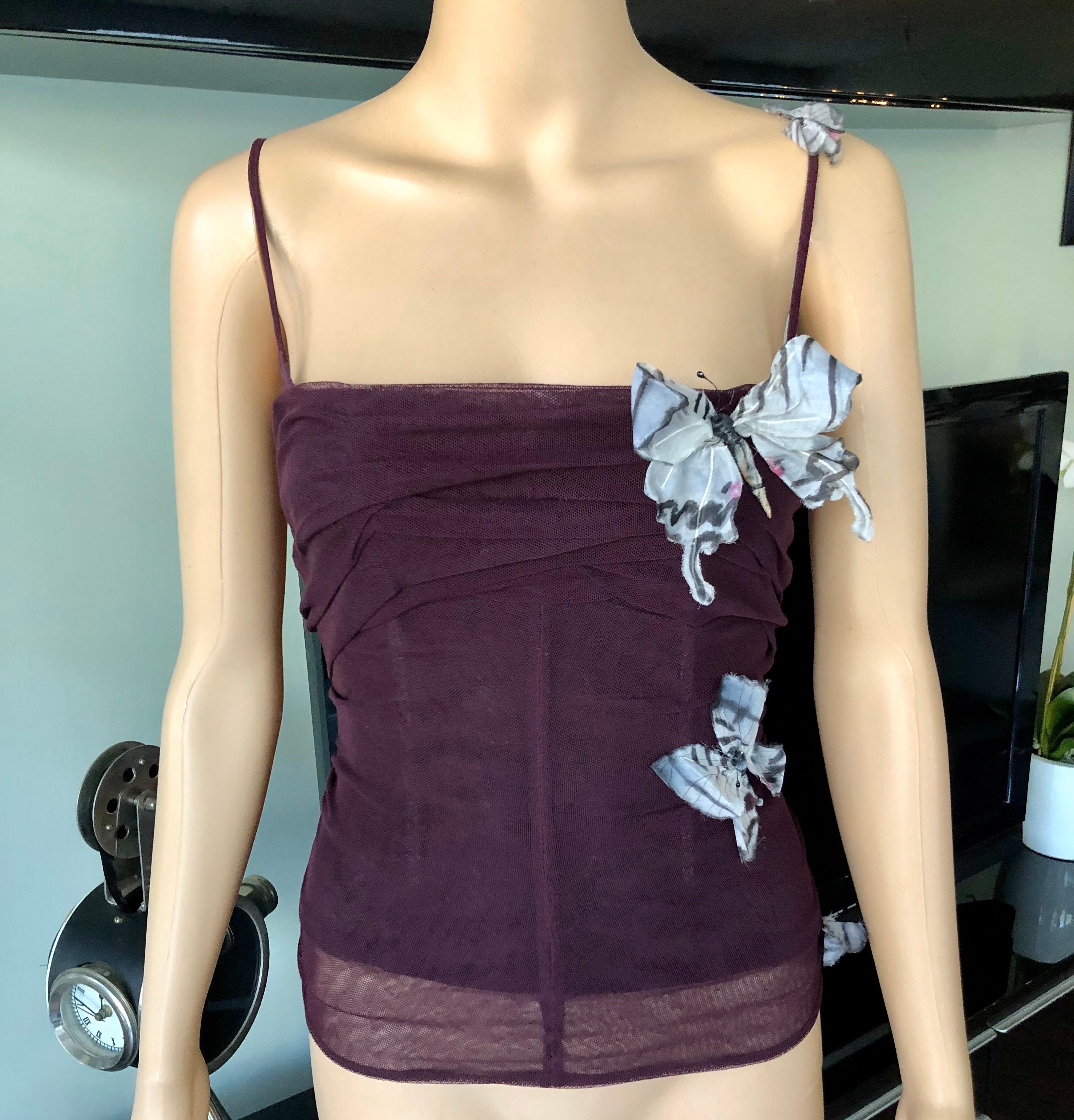 Dolce & Gabbana S/S 1998 Vintage Stromboli Collection Butterfly Top

Dolce & Gabbana sleeveless top with butterfly applique throughout and expsoed zip closure at back. Please note the size tag has been removed. Please find below the approximate