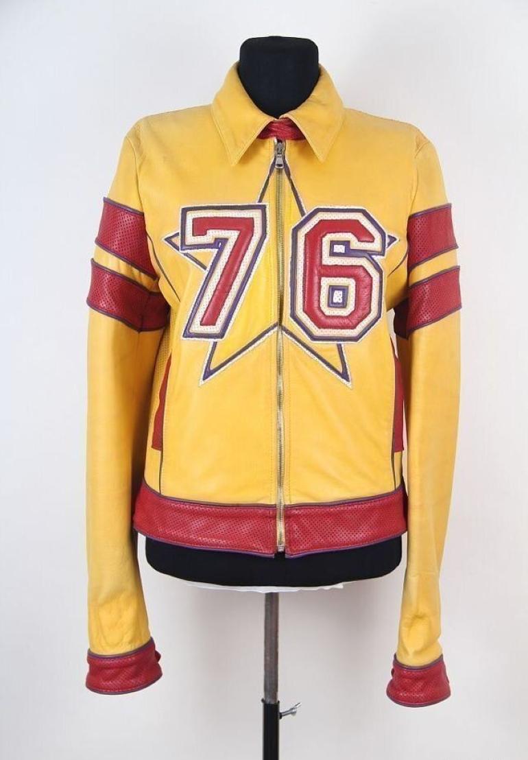 DOLCE & GABBANA S/S 2001 Leather Sport ‘Michigan’ Jacket
A perforated leather sport jacket from Dolce & Gabbana from the 2000s. It features a star on the chest with the number “76”, red perforated leather zip cuffs and arm guards – all with purple