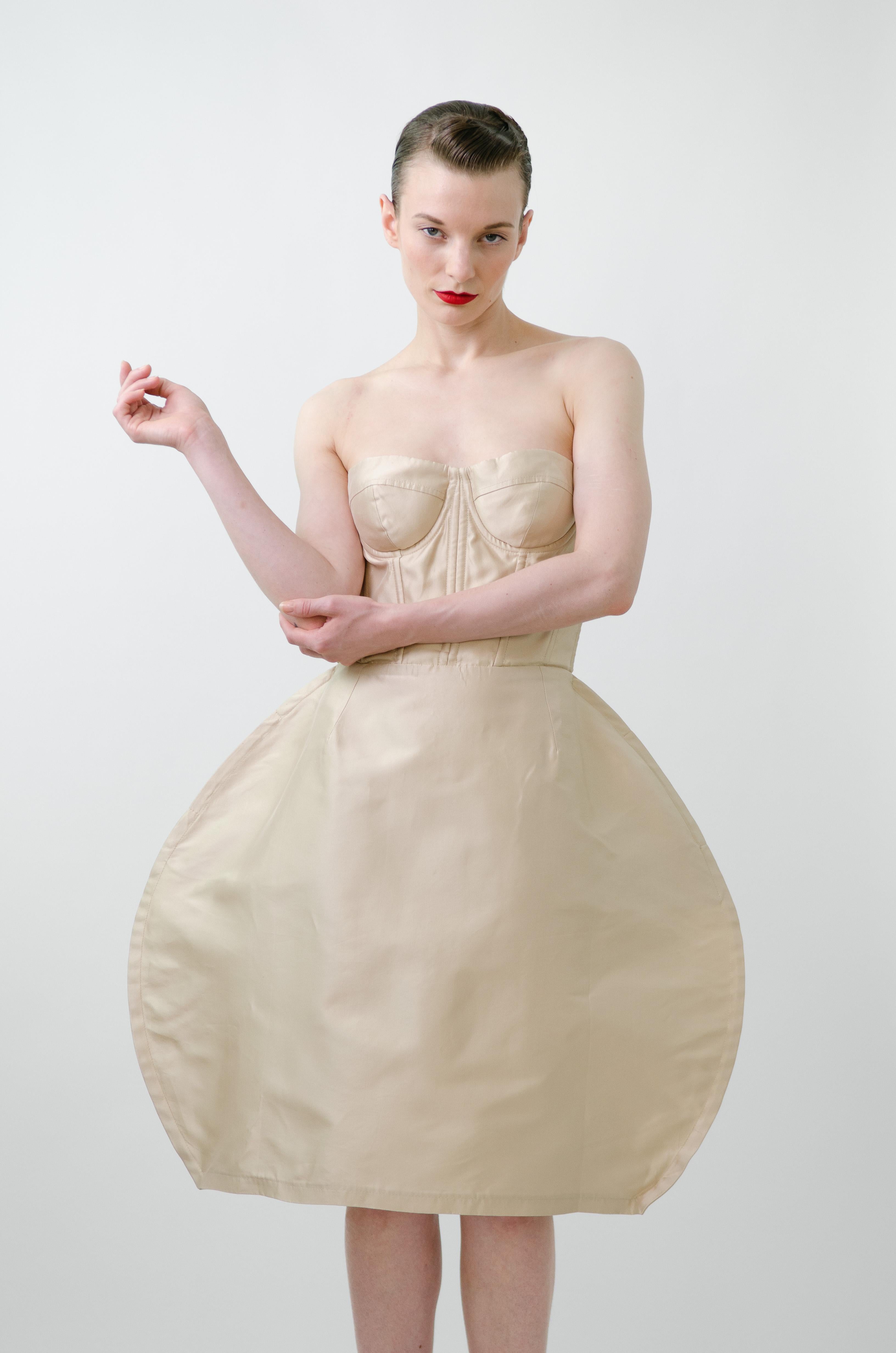 Dolce & Gabbana Spring Summer 2009 runway sculptural bustier dress 

Brand: Dolce & Gabbana
Designer: Domenico Dolce & Stefano Gabbana
Collection: Spring Summer 2009
Fabric: Silk
Color: Champagne
Size:  IT42

Sculptural, architectural and feminine.