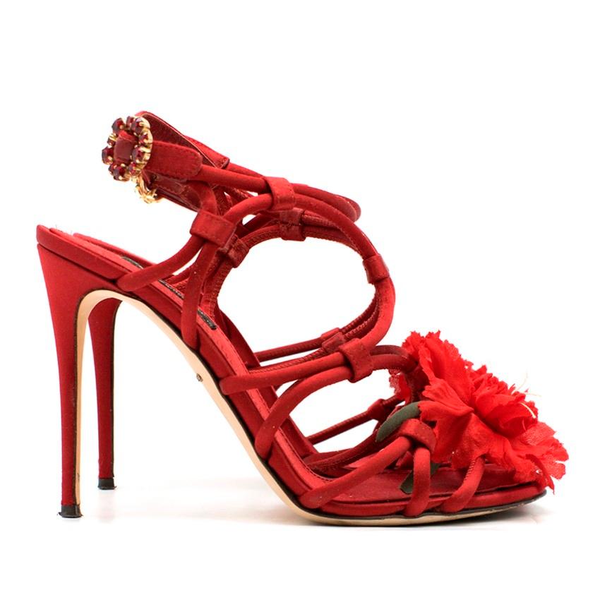 Dolce & Gabbana Satin Strappy Flower Embellished Sandals

- Deep ruby red satin upper
- Intricate strappy cut-out design
- High covered stiletto heel
- Ankle strap fastening with a faux ruby flower shaped buckle
- Gold-tone hardware
- A red flower