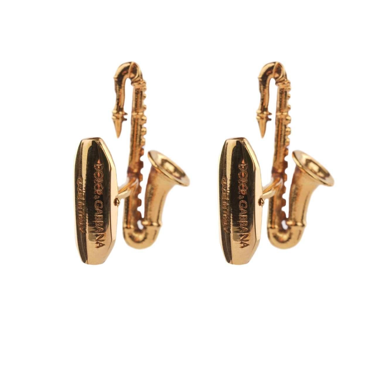 - Saxophone Cufflinks in gold galvanized metal by DOLCE & GABBANA - New with Tag - MADE IN ITALY - Former RRP: EUR 245 - Engraved Dolce&Gabbana Logo - Nickel free - Model: WFJ3S9-W0001-ZOO00 - Material: 100% Brass - Color: Gold - Measurements: appr.