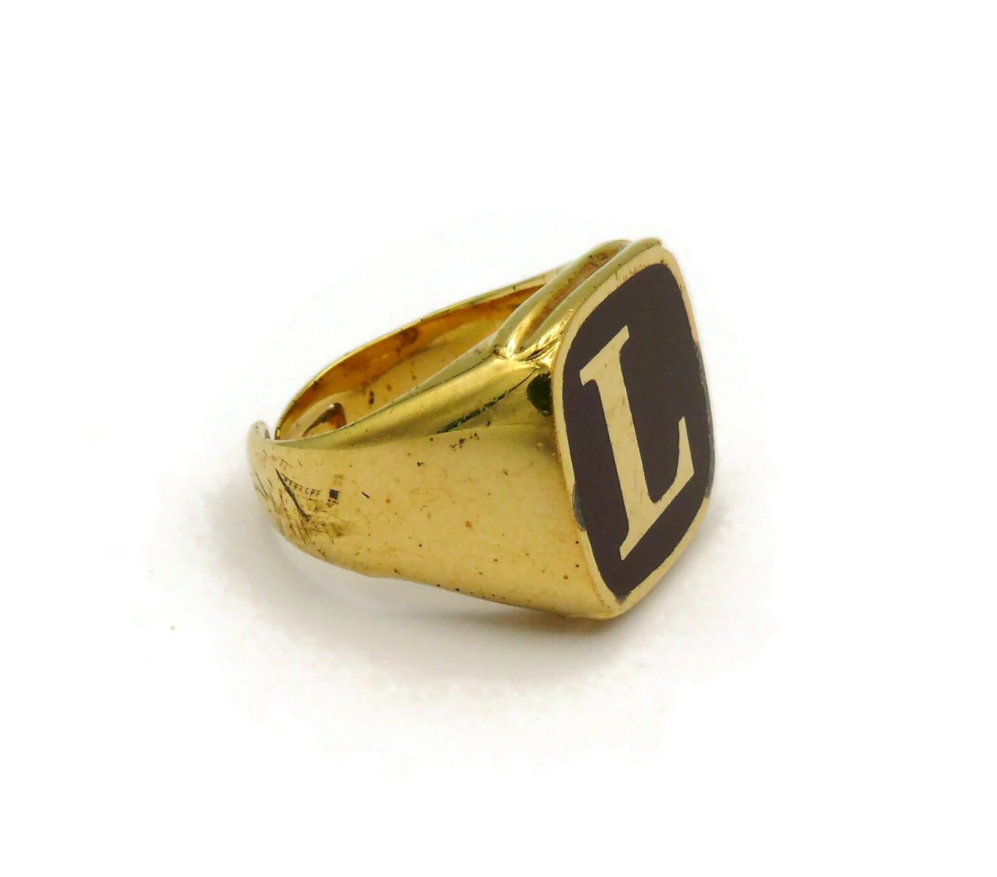 DOLCE & GABBANA Set von vier goldfarbenen Ringen L O V E für Damen oder Herren im Angebot