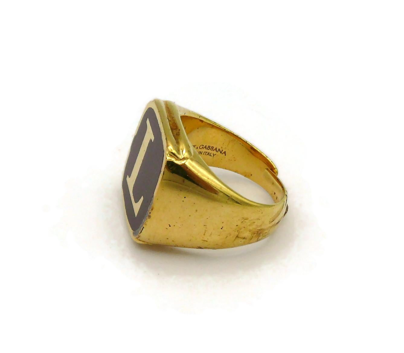 DOLCE & GABBANA Set of Four Gold Tone Rings L O V E In Fair Condition For Sale In Nice, FR