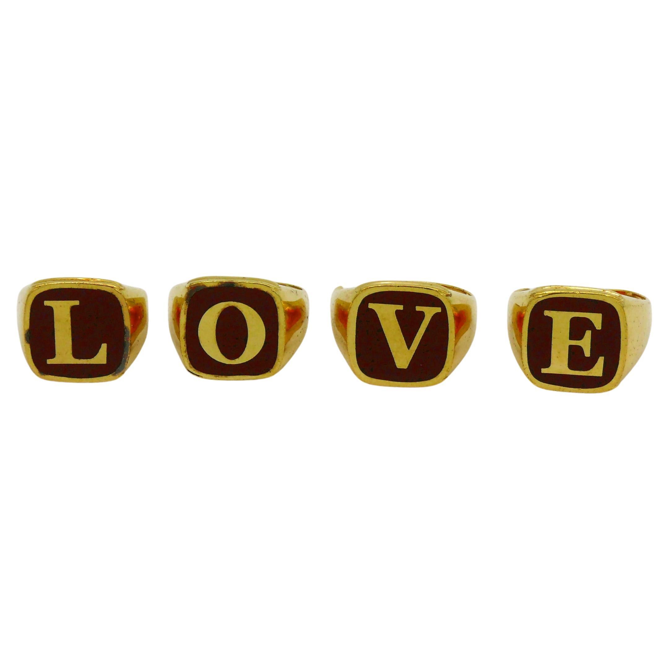 DOLCE & GABBANA Set von vier goldfarbenen Ringen L O V E im Angebot