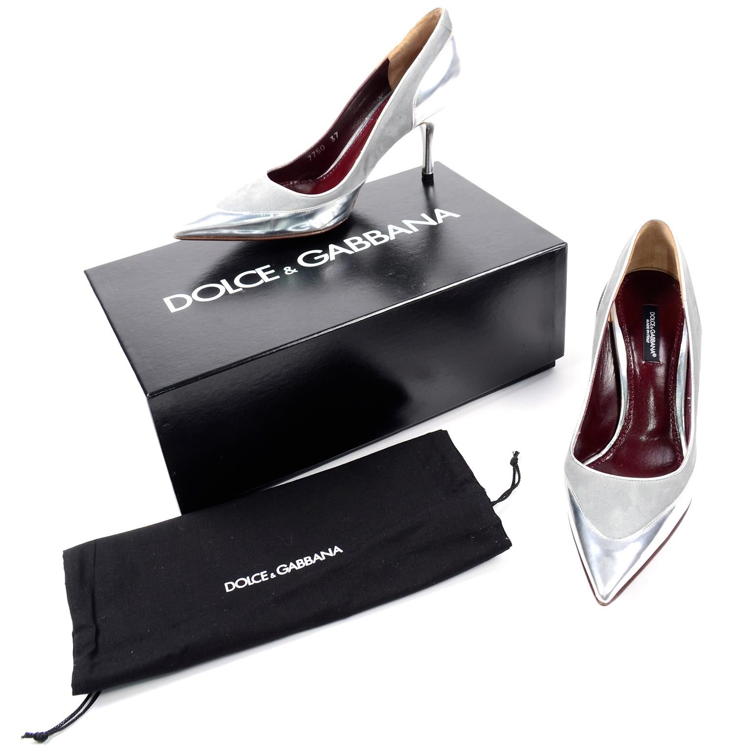 This is a beautiful pair of Dolce & Gabbana silver heels made of both a shiny silver leather and a grey suede with pointed toes and spiked heels.
Marked a size 37, purchased at Saks Fifth Avenue and the description reads; Decollete Cachemire +