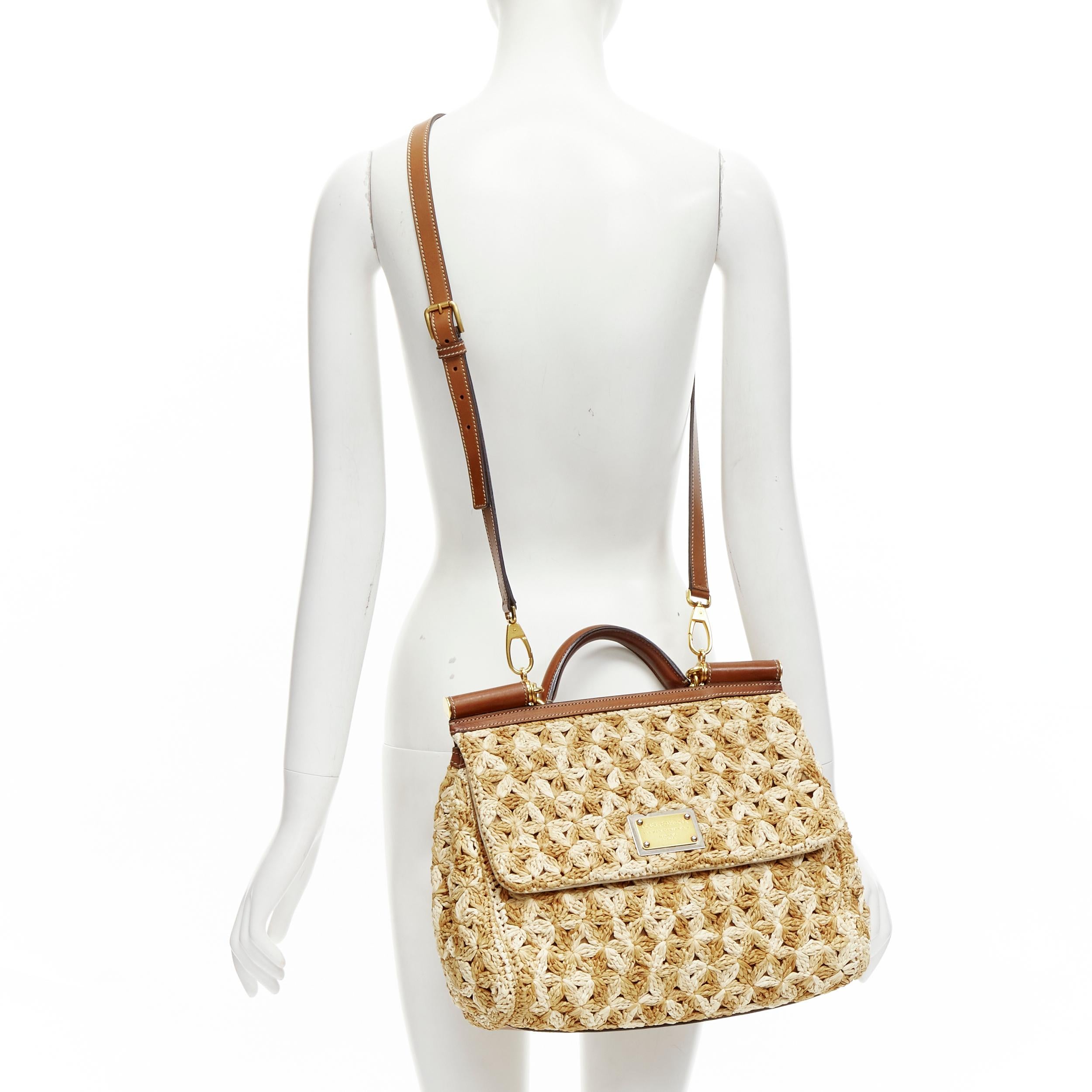 DOLCE GABBANA Sicily beige raffia crochet large top handle crossbody bag
Reference: TGAS/C01668
Brand: Dolce Gabbana
Designer: Domenico Dolce and Stefano Gabbana
Model: Sicily
Material: Raffia, Leather
Color: Beige, Brown
Pattern: Solid
Closure: