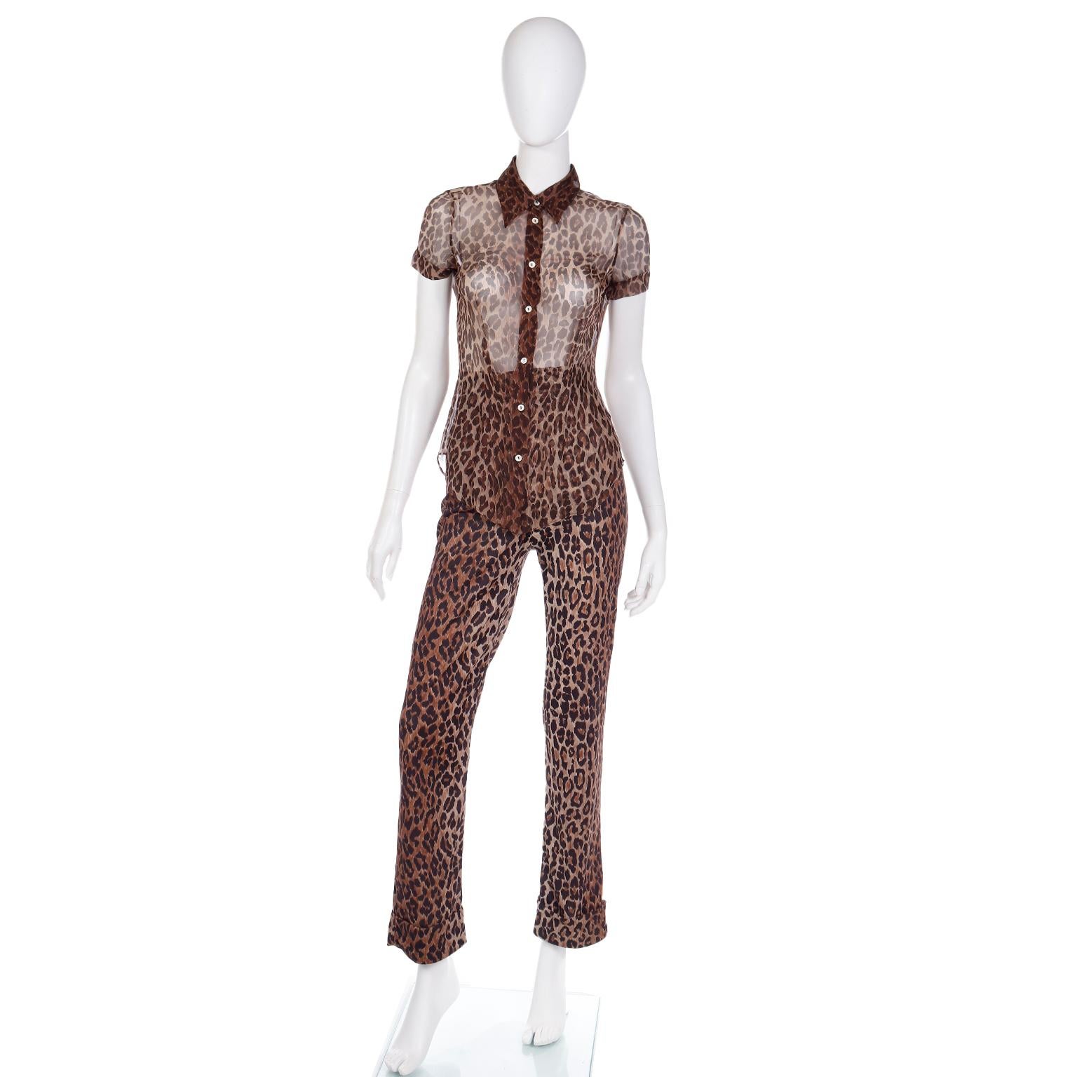 We love Dolce and Gabbana animal prints and this 2 piece outfit is in a luxe brown leopard print. The ensemble includes a sheer short sleeve button front blouse and a pair of high waisted silk trousers. The top is a sheer silk and it has a pointed