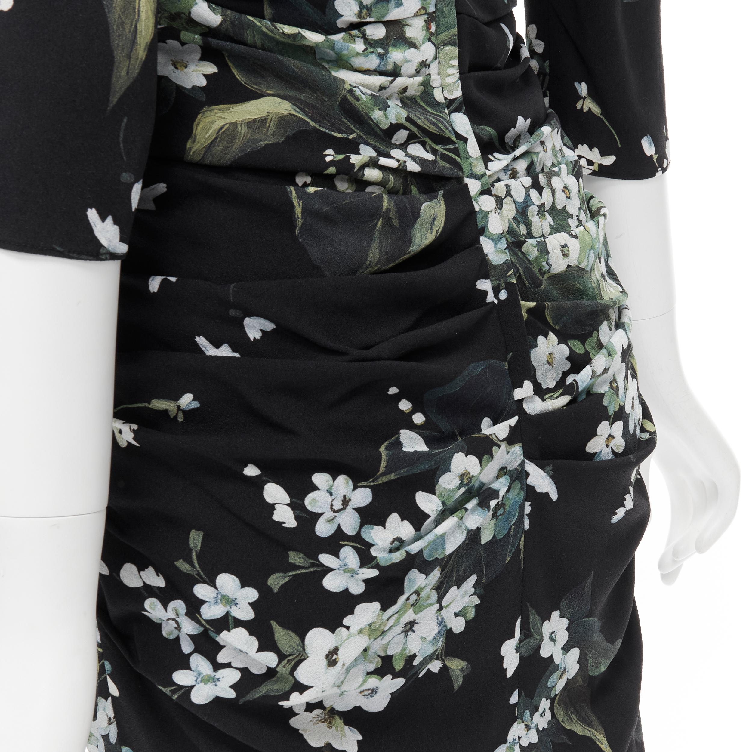 DOLCE GABBANA silk black white green floral print ruched bodycon dress IT40 XS 
Reference: TGAS/B01834 
Brand: Dolce & Gabbana 
Material: Silk 
Color: Black 
Pattern: Floral 
Closure: Zip 
Extra Detail: Round neck. 3/4 sleeve. Ruched gathered
