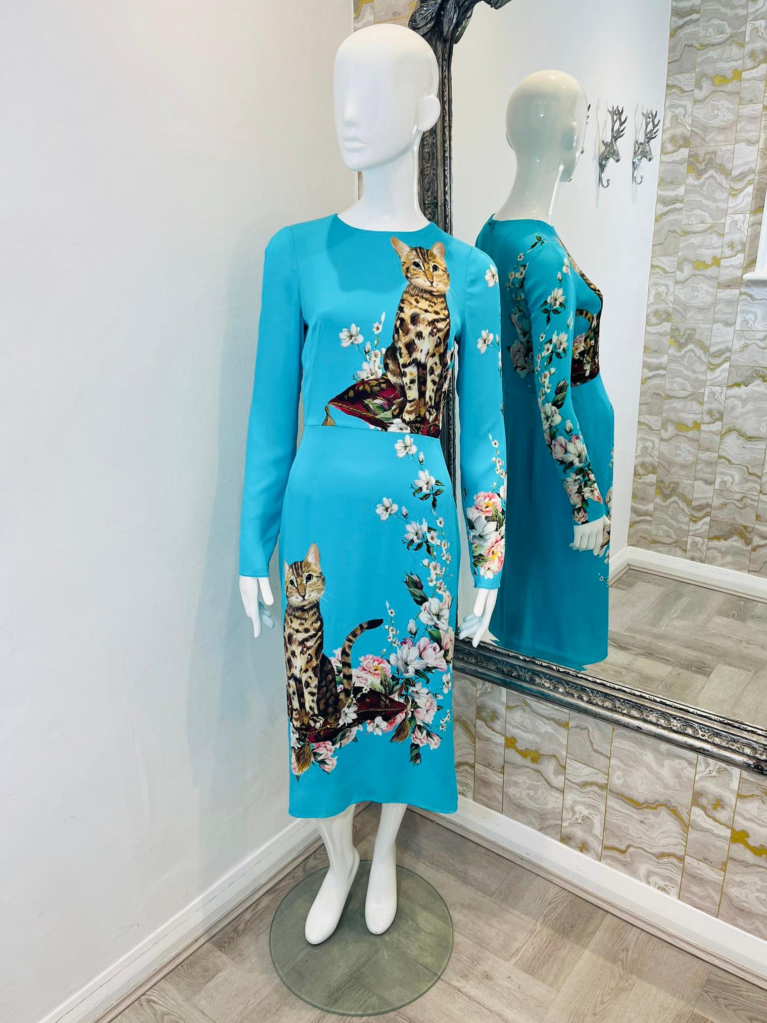 Dolce & Gabbana Silk Cat Print Dress

2018 Runway dress in turquoise blue with cat and floral print.

Size - 44IT

Condition - Excellent

Composition - Silk 