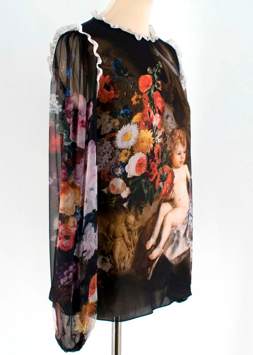 Dolche & Gabbana Silk Printed Blouse

- silk printed top
- long sleeve
- round neckline
- white lace trim
- floral and child print
- lightweight and sheer

Please note, these items are pre-owned and may show some signs of storage, even when unworn