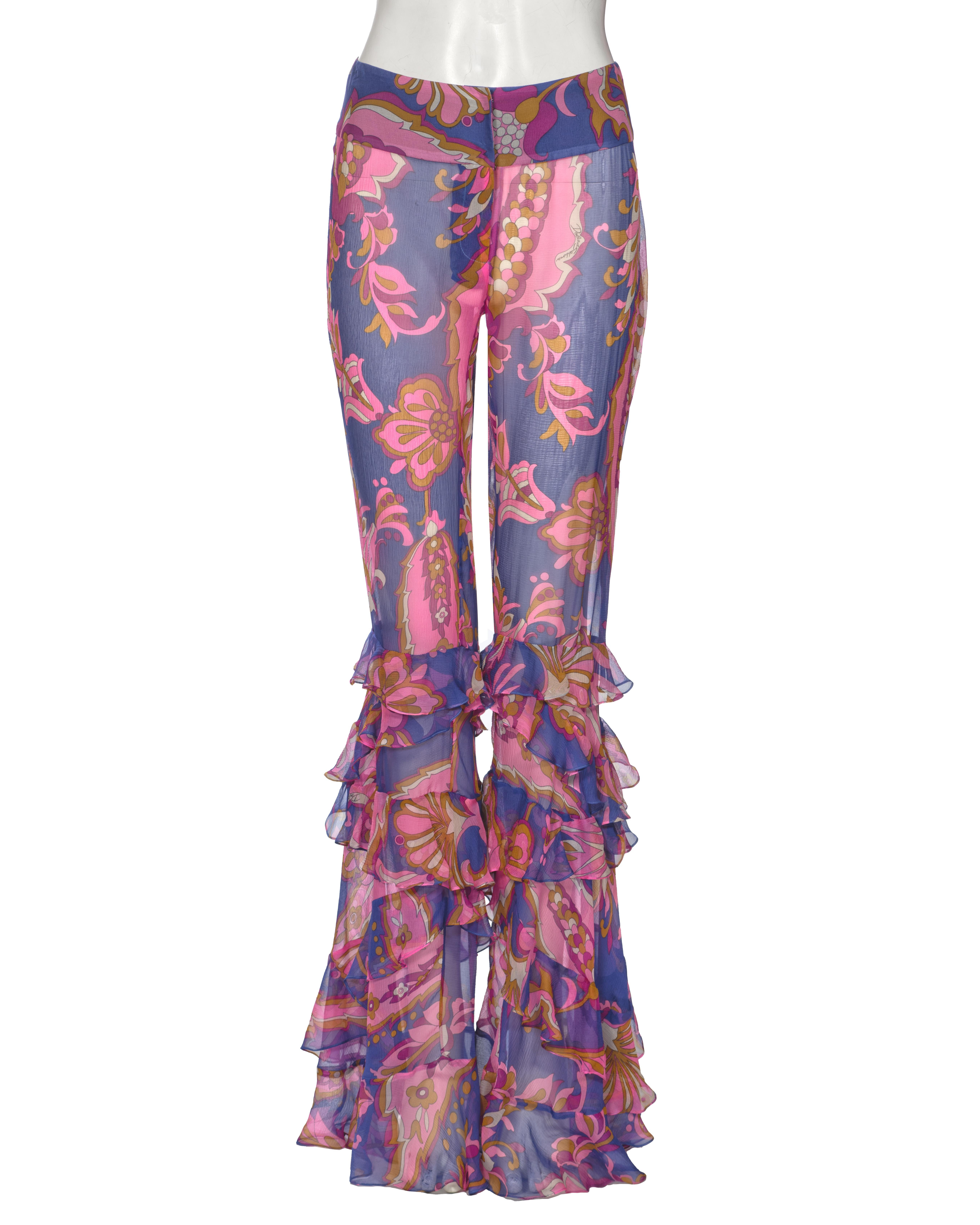 ▪ Dolce & Gabbana Silk Chiffon Ruffled Flared Pants
▪ Spring-Summer 2004
▪ Sold by One of a Kind Archive
▪ Semi-transparent silk chiffon pants with floral and paisley-inspired print
▪ Layered, cascading ruffles that begin at the knee and extend to