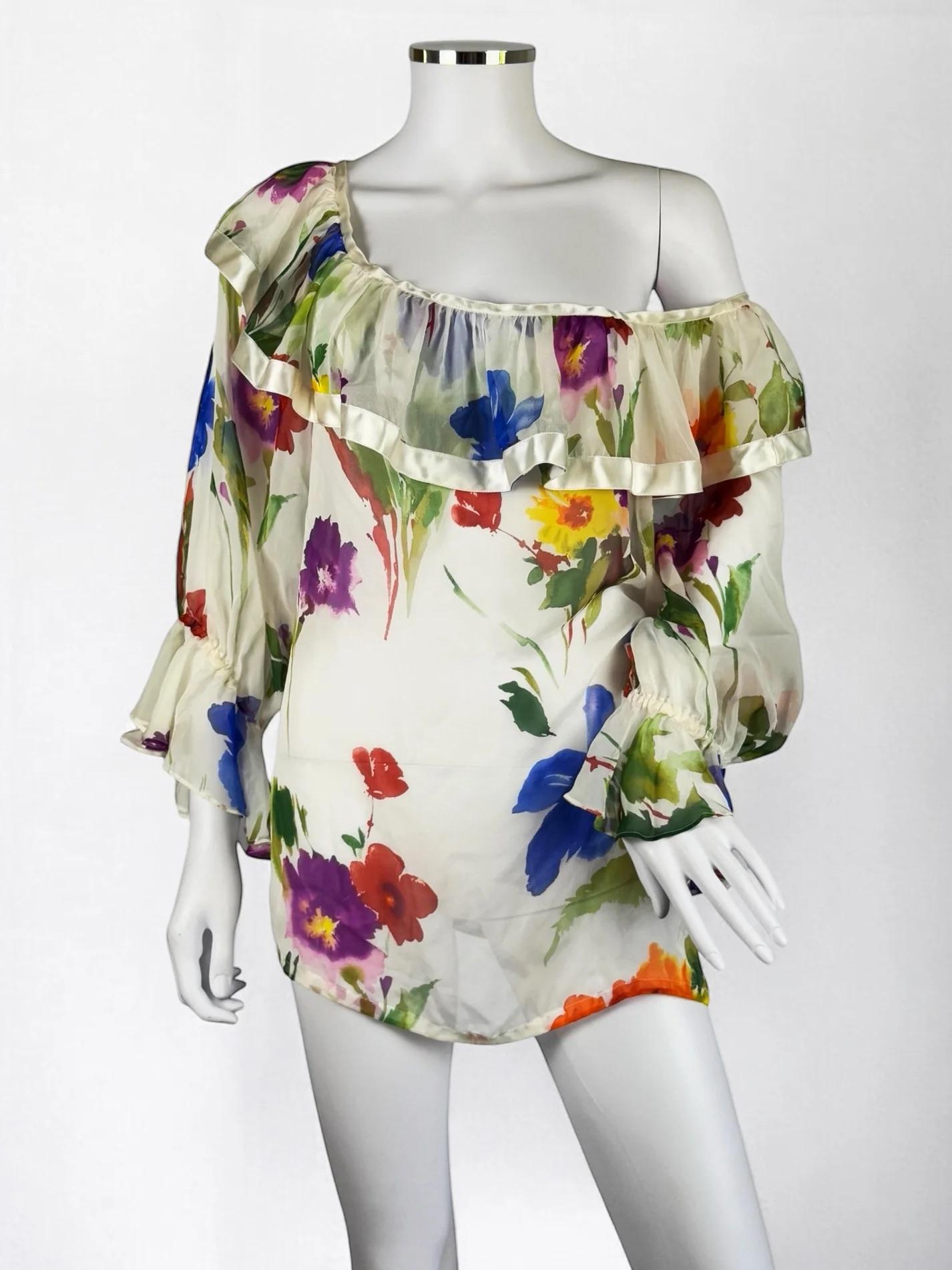 Dolce & Gabbana silk floral blouse, Spring Summer 2002
An iconic print from this season which which was worn by Monica Bellucci at Cannes Festival 2002 in the form of a gown
100% silk, sheer
Ruffle detail with silk satin trim 
Size: IT 42