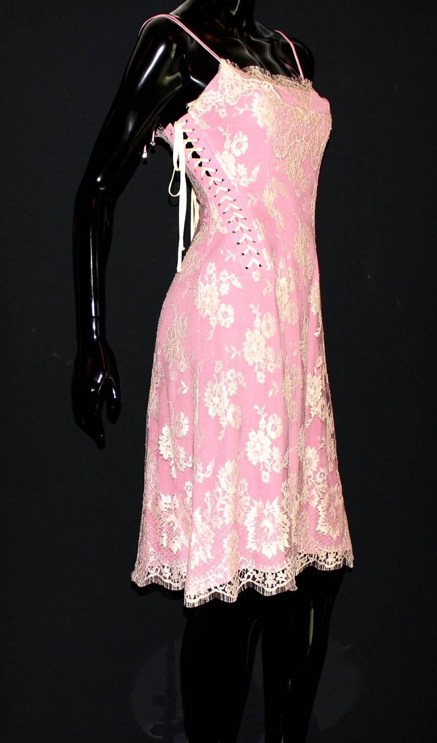 GORGEOUS ROMANTIC DOLCE & GABBANA SILK & LACE DRESS

LACE UP DETAILS

ONE OF THE MOST BEAUTIFUL PIECES BY

DOLCE & GABBANA

Made out of the finest handmade crochet-knit cream French lace & pink silk 
Corset-style boned upper part
Lace up details on