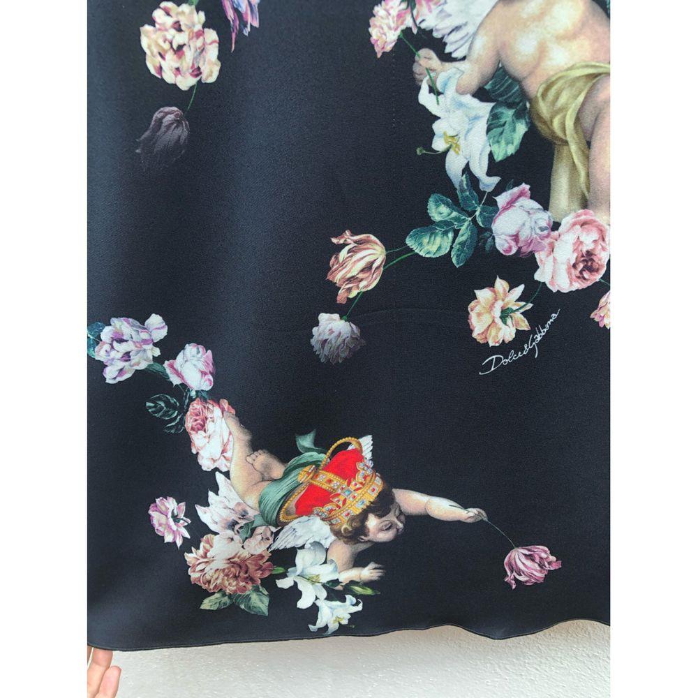 Dolce & Gabbana Silk Mid-Length Skirt in Black

Dolce & Gabbana black silk skirt with angels from the fall 2018 fashion show. Elastic waistband and back zip closure. Size shown 36, waist 33cm, hips 42cm and 75cm long. It has only a small thread