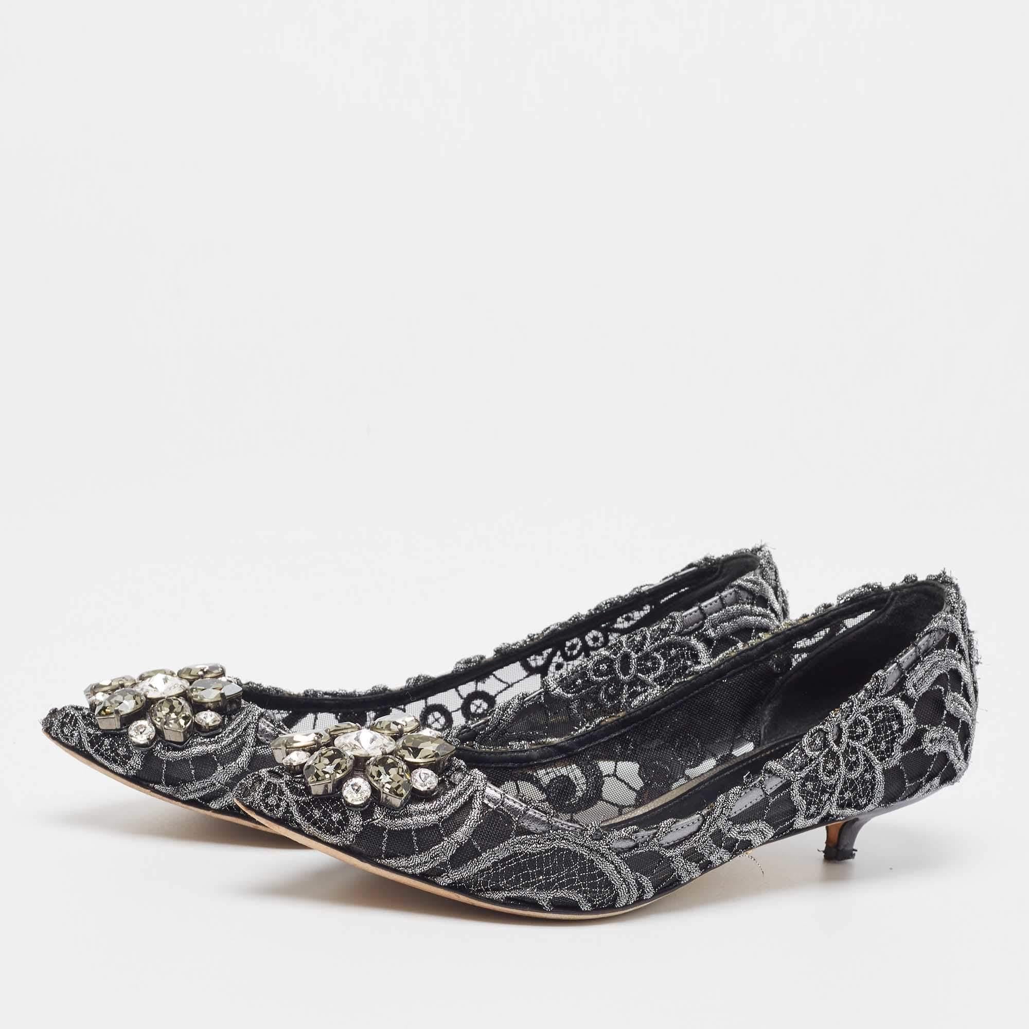 A vision of beauty, this pair of Dolce & Gabbana pumps embodies an appealing visual display. It is created from lace with a striking embellishment on the toes and it is uplifted on 5cm heels to offer you the perfect height along with comfort.


