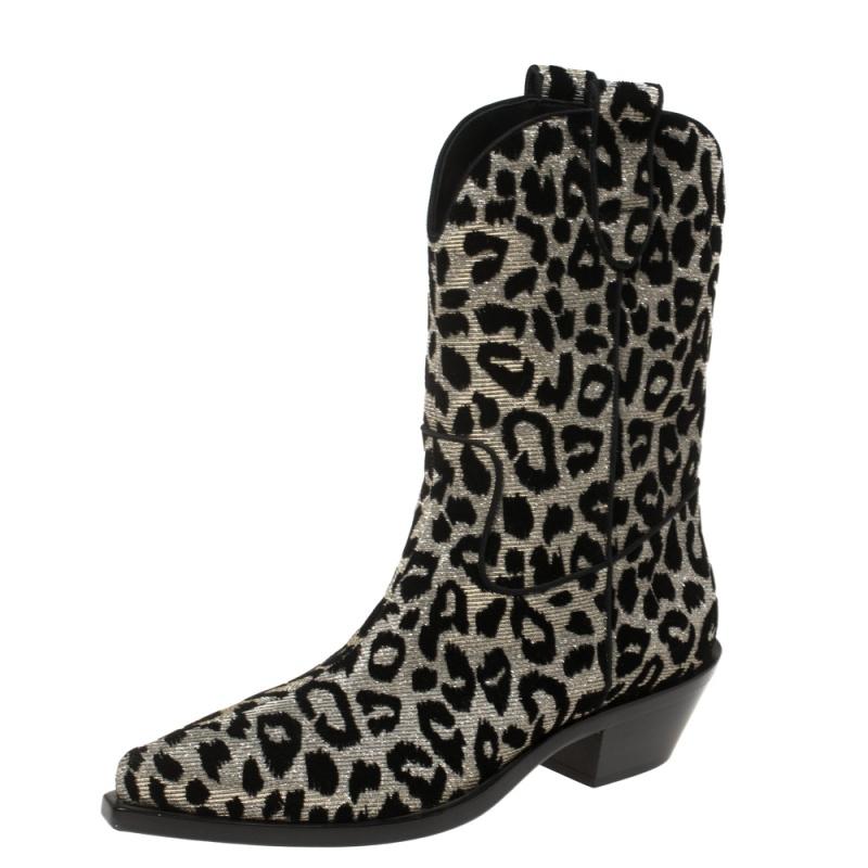 Known for its finesse and impeccable artistry, Dolce & Gabbana again surprises us with these stylish cowboy boots. Crafted from leopard-printed lurex fabric, the boots feature almond toes and are lined with leather. Small heels complete these