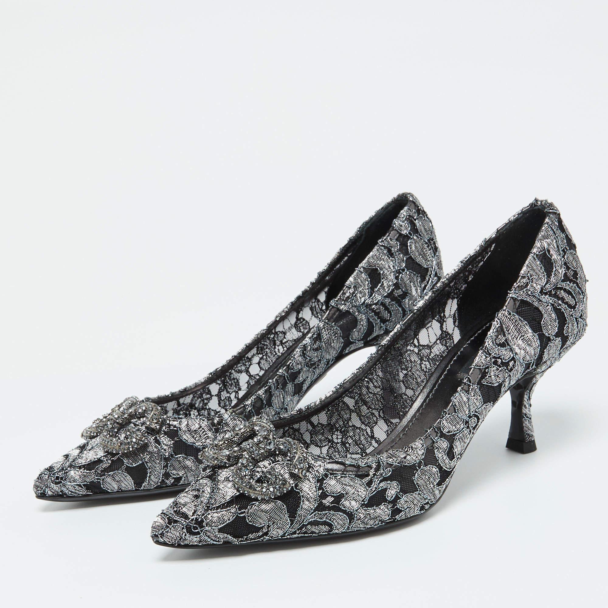 Discover footwear elegance with these Dolce and Gabbana lace pumps. Meticulously designed these heels marry fashion and comfort ensuring you shine in every setting.