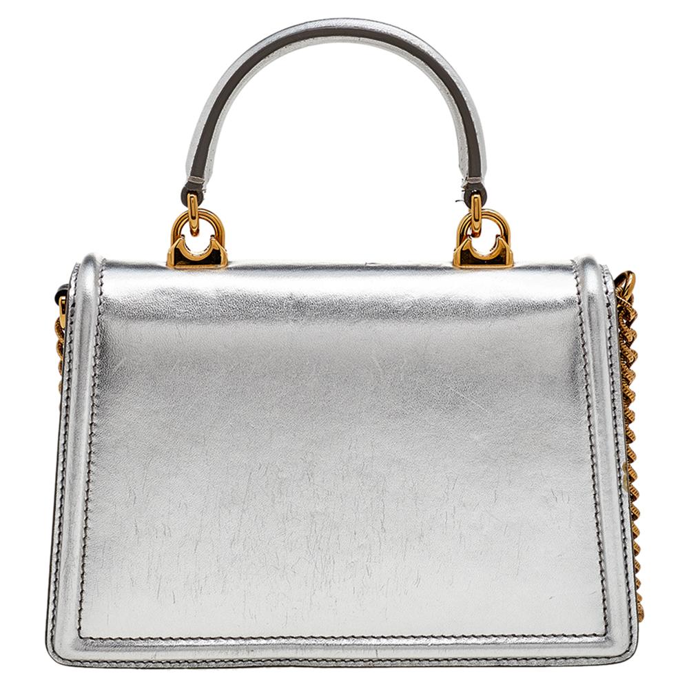 Coming from the House of Dolce & Gabbana, this Devotion bag is designed to offer functionality and style! It is made from silver leather, with a gold-tone logo Crest adorning the front. It features a top handle, a spacious leather-lined interior,