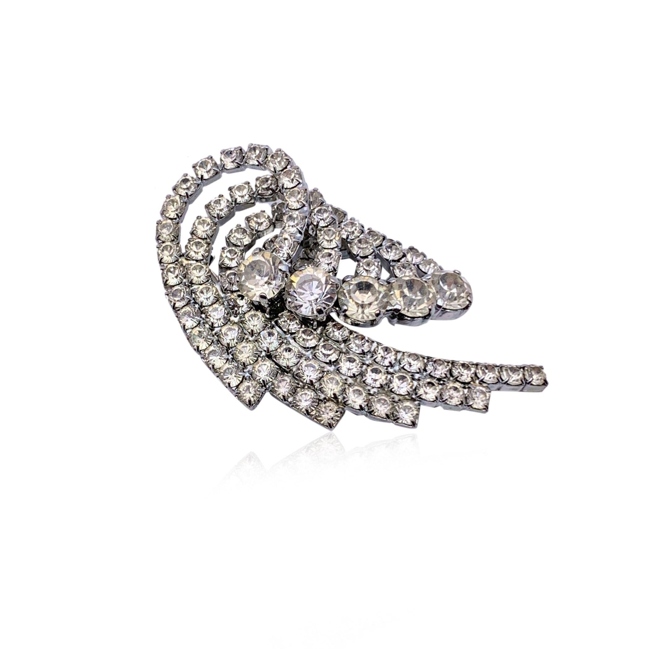 Beautiful Dolce & Gabbana crystal brooch in silver metal. Height: 3 inches - 7.6 cm. Signed 'Dolce & Gabbana - made in Italy' on the back. Condition A - EXCELLENT Gently used. Please check the photos carefully and ask if you need to know more