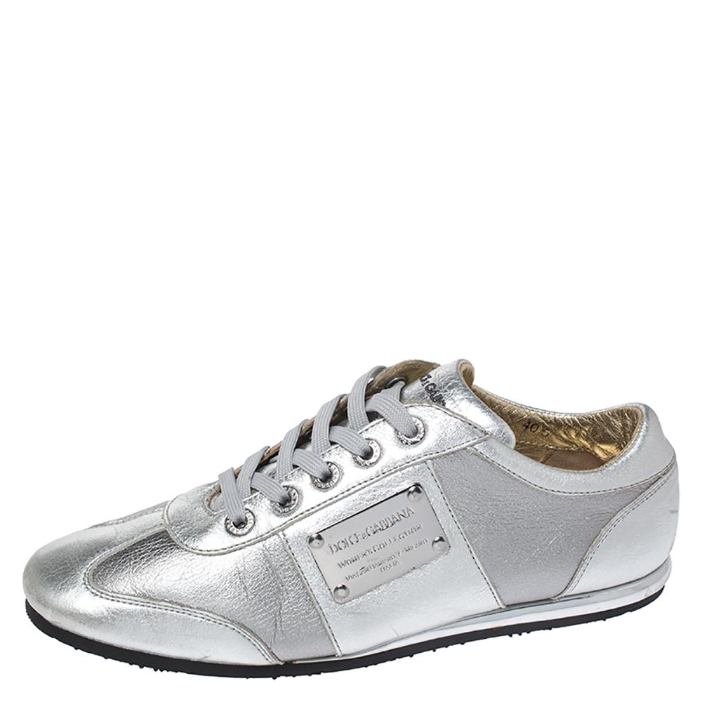 These limited-edition Dolce & Gabbana sneakers are simple yet stylish. They've been crafted from leather and feature a metallic silver exterior with a lace-up vamp. These sneakers have been styled as a low top and carry the brand's signature label