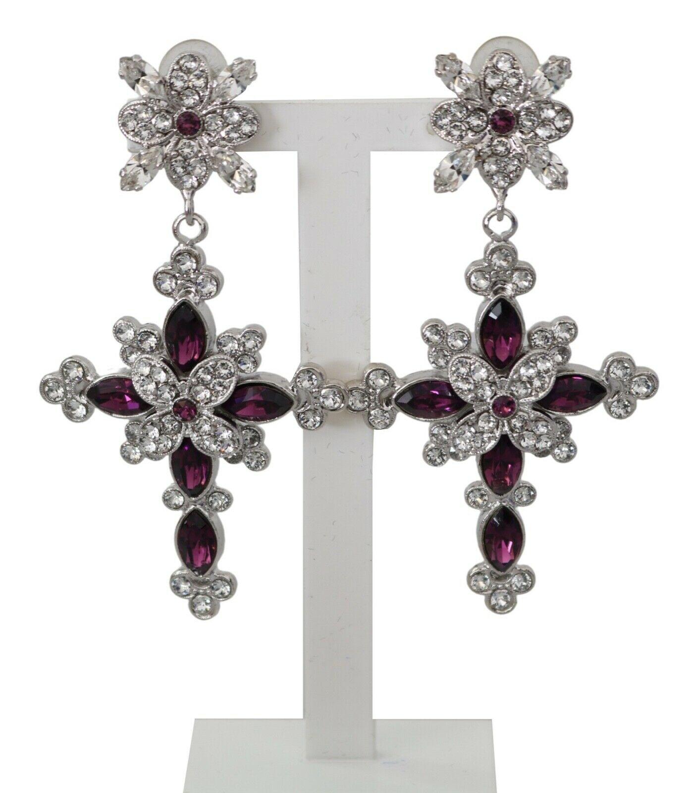  Gorgeous brand new with tags, 100% Authentic Dolce & Gabbana silver-colored, cross-shaped earrings made of lightweight electroplated brass. The model is adorned with sparkling transparent and lilac Swarovski crystals. Wear it as a set or paired