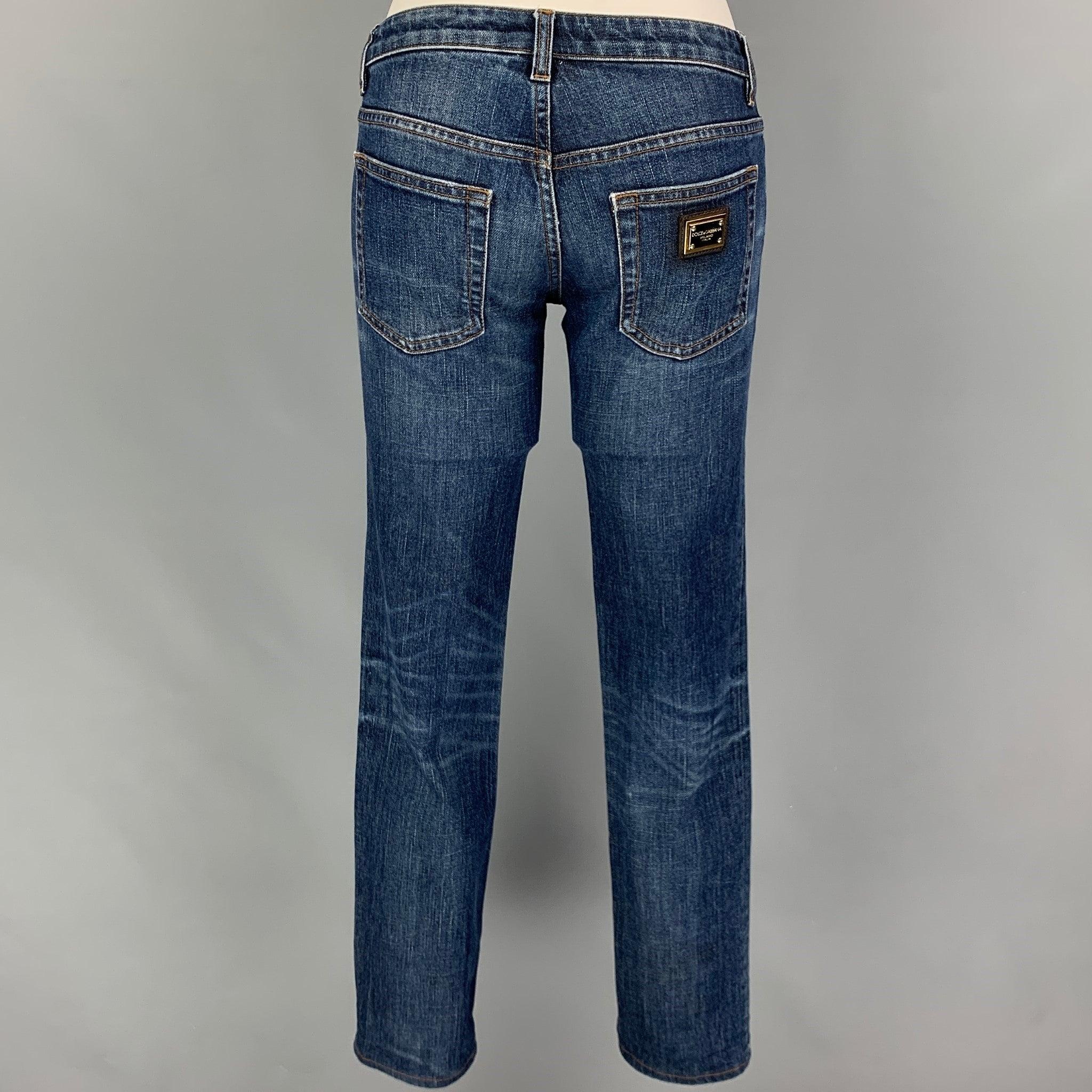 DOLCE & GABBANA jeans comes in a blue washed cotton featuring a skinny fit, contrast stitching, and a zip fly closure. Made in Italy.
Very Good
Pre-Owned Condition. 

Marked:   36 

Measurements: 
  Waist: 28 inches  
Rise: 6.5 inches  Inseam: 31