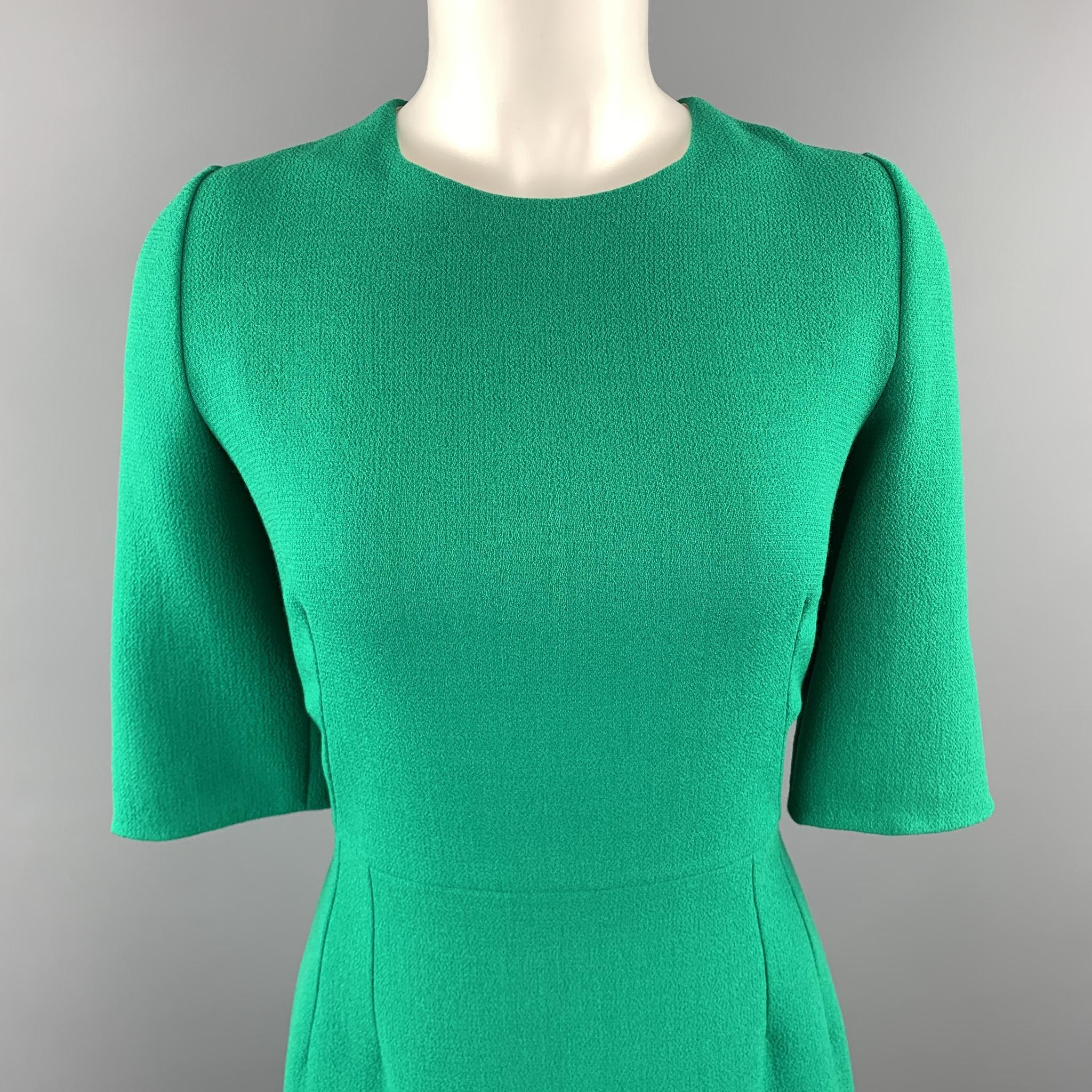 DOLCE & GABBANA shift dress comes in green wool crepe with a round neckline, three quarter sleeves, and zip closure. Made in Italy.

Excellent Pre-Owned Condition.
Marked: IT 46

Measurements:

Shoulder: 15 in.
Bust: 38 in.
Waist: 31 in.
Hip: 42