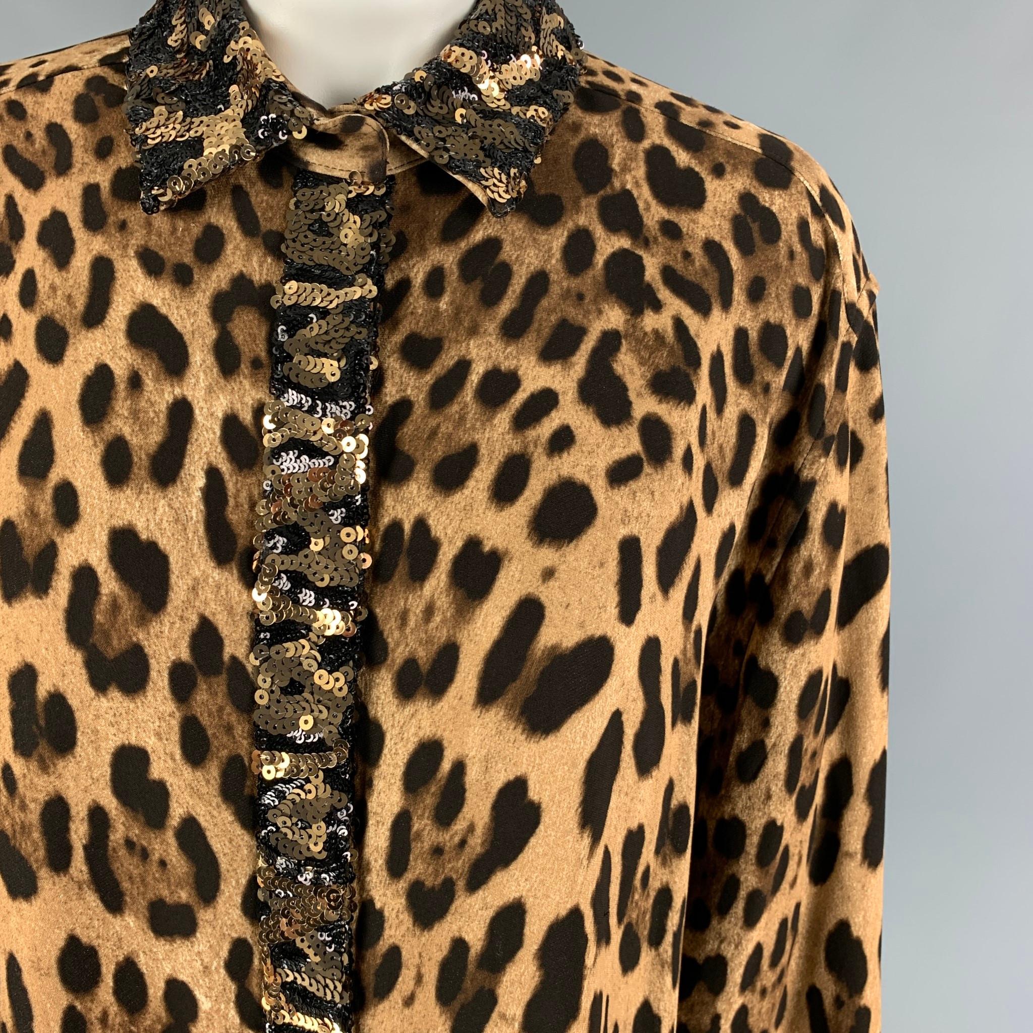 DOLCE & GABBANA shirt comes in a tan & brown animal print viscose blend featuring a sequin trim, spread collar, and a hidden placket closure. Made in Italy. 

Excellent Pre-Owned Condition.
Marked: 46

Measurements:

Shoulder: 18.5 in.
Bust: 44